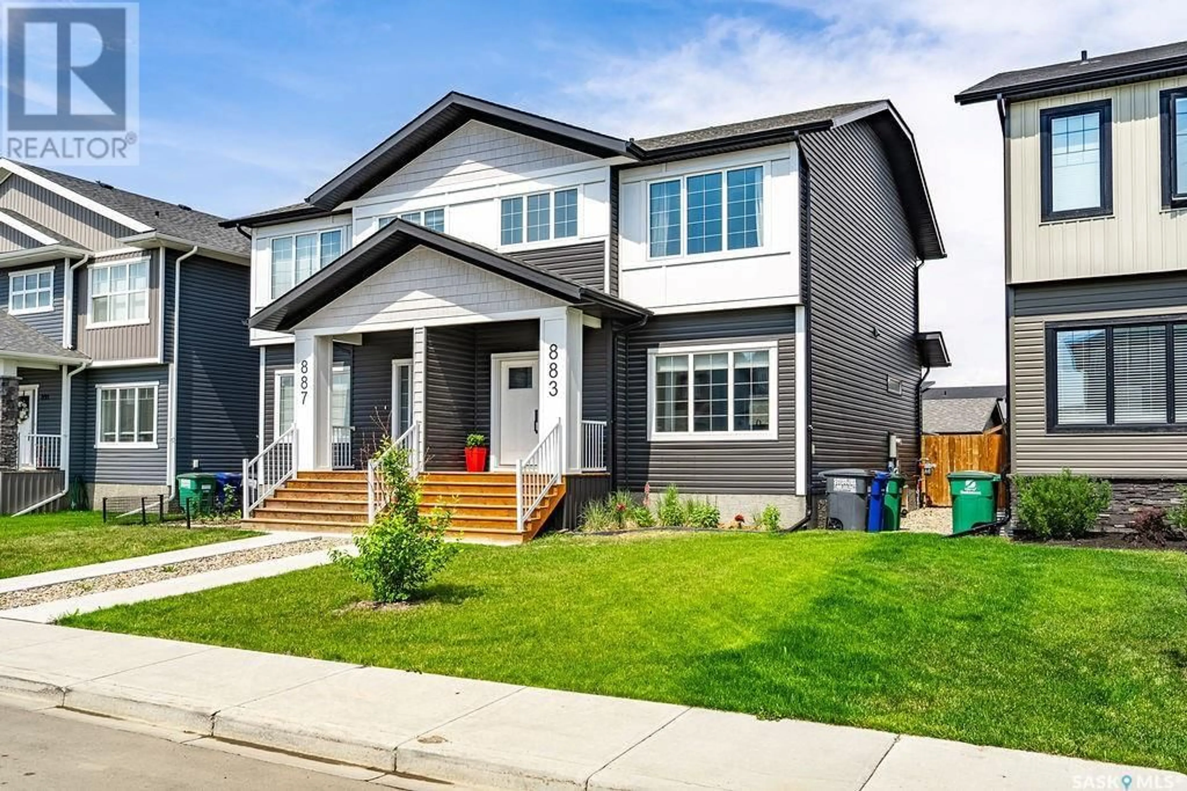 Home with vinyl exterior material, street for 883 MCFAULL RISE, Saskatoon Saskatchewan S7V0S9