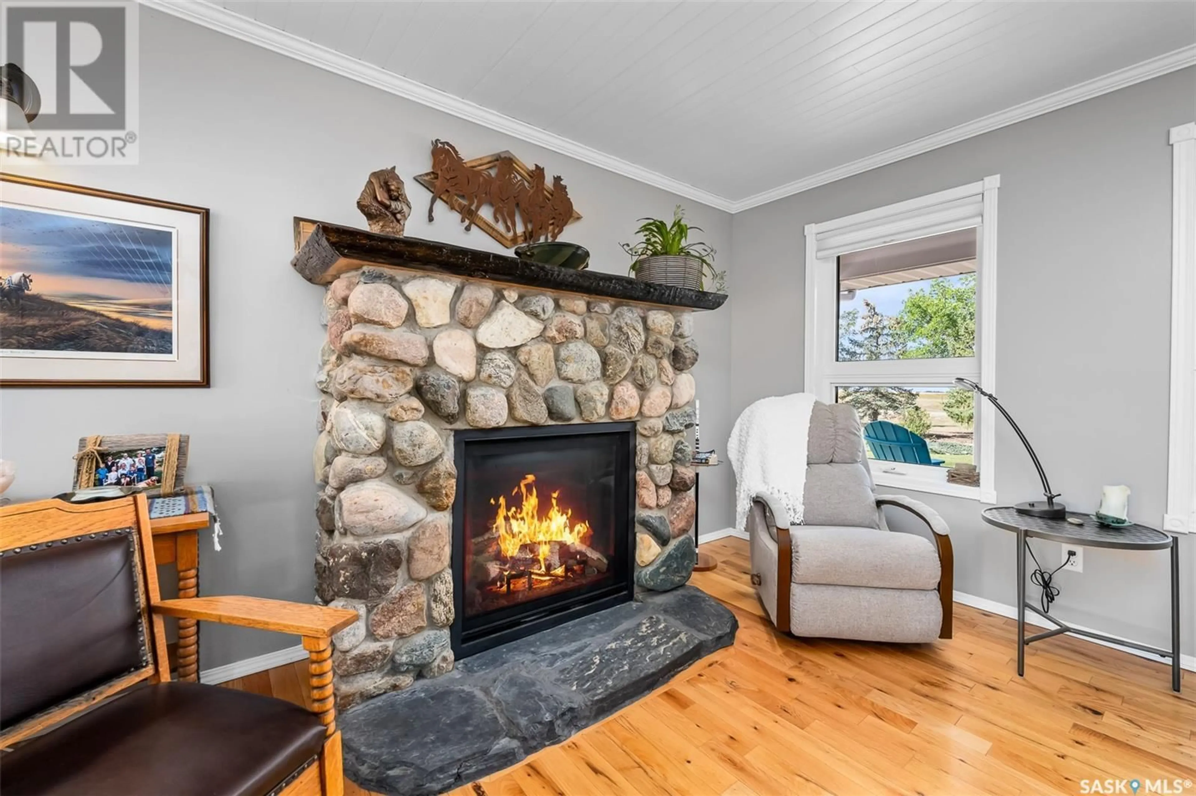 Living room with furniture, wood/laminate floor for 161 VEILLARD/SARGENT ACREAGE, Moose Jaw Rm No. 161 Saskatchewan S0H0N0