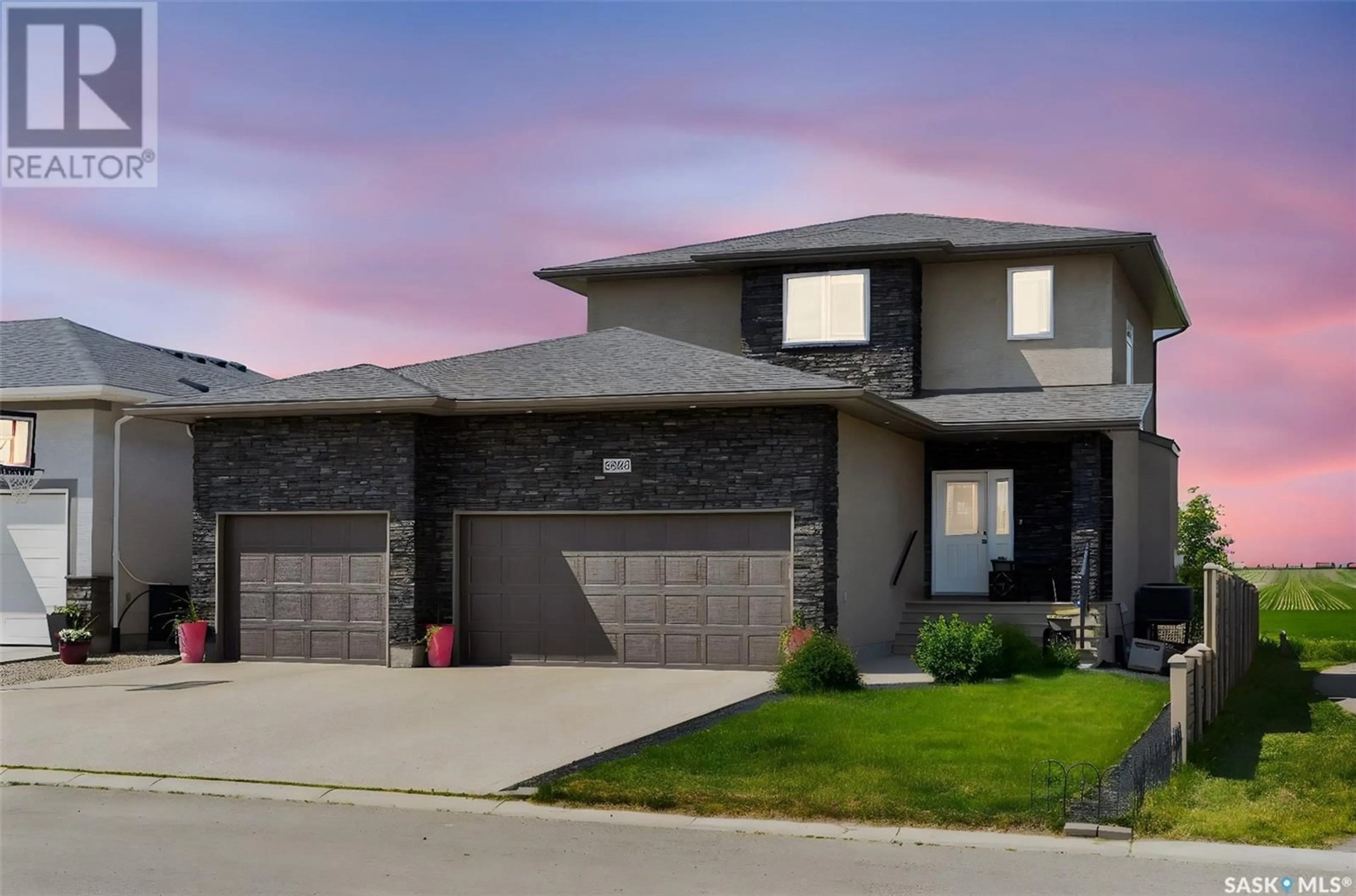 Home with brick exterior material, street for 6902 MAPLE VISTA DRIVE, Regina Saskatchewan S4X0J8
