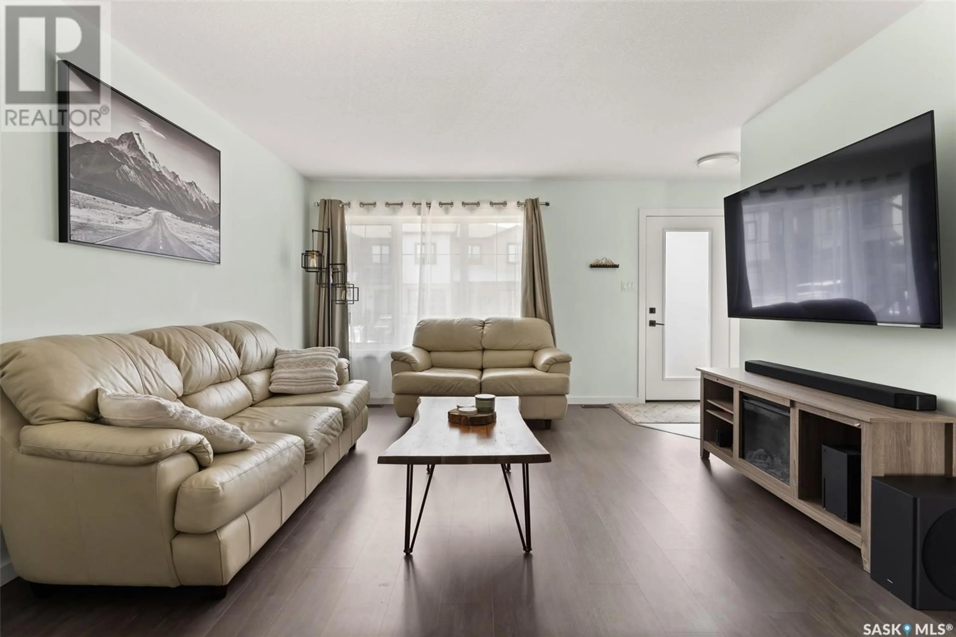 Living room with furniture, wood/laminate floor for 2715 - 121 NARCISSE DRIVE, Regina Saskatchewan S4X0P8