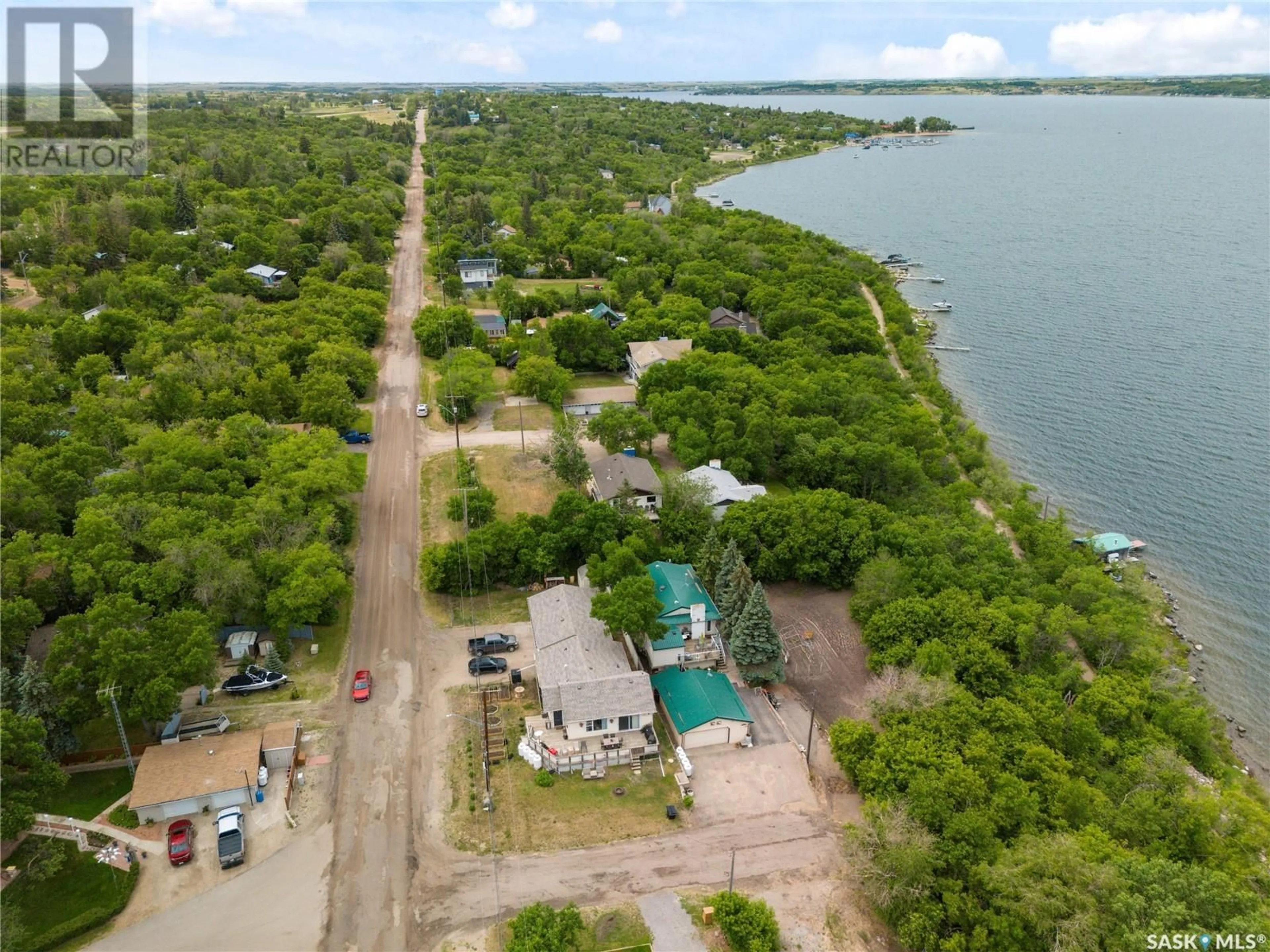 A pic from outside/outdoor area/front of a property/back of a property/a pic from drone, water/lake/river/ocean view for 461 13TH STREET, Regina Beach Saskatchewan S0G4C0