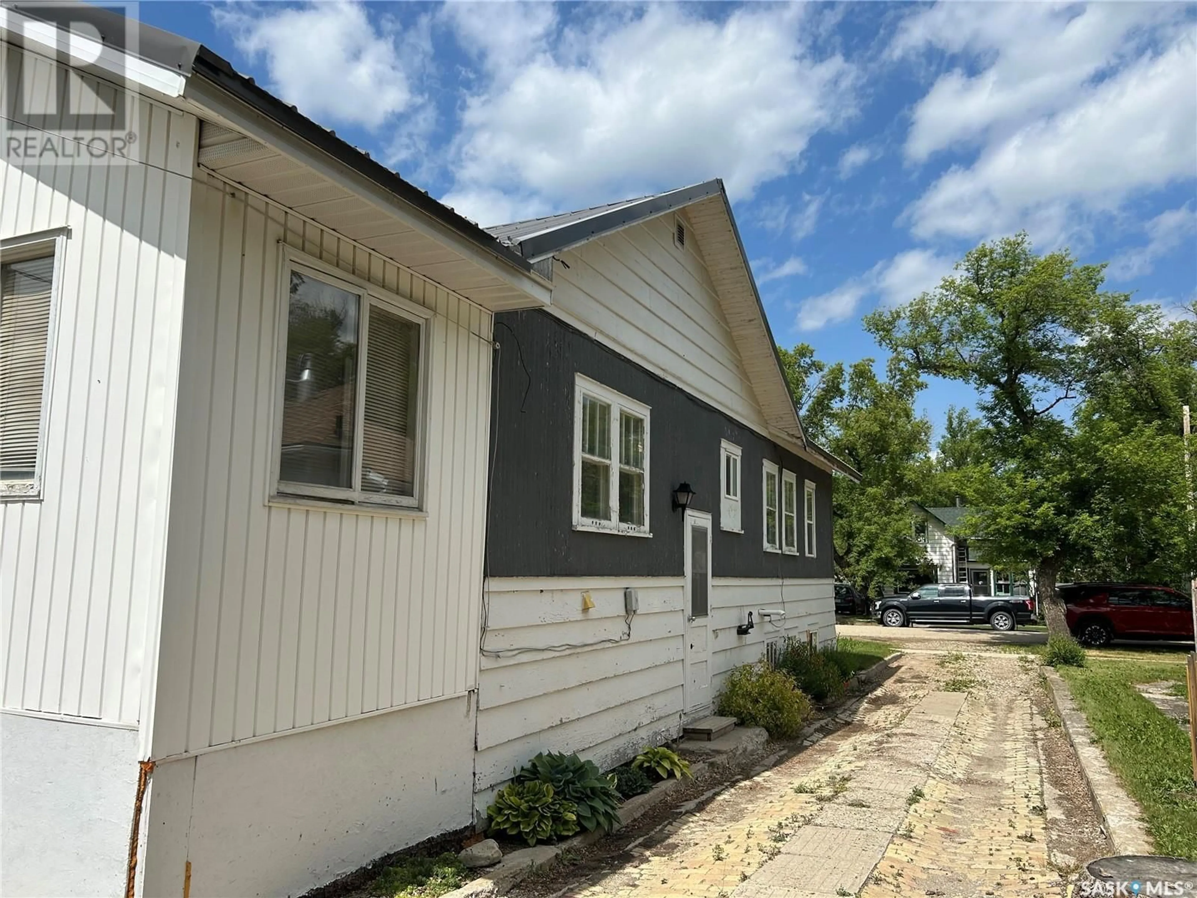 Home with vinyl exterior material, street for E - 106 3RD AVENUE, Nokomis Saskatchewan S0G3R0