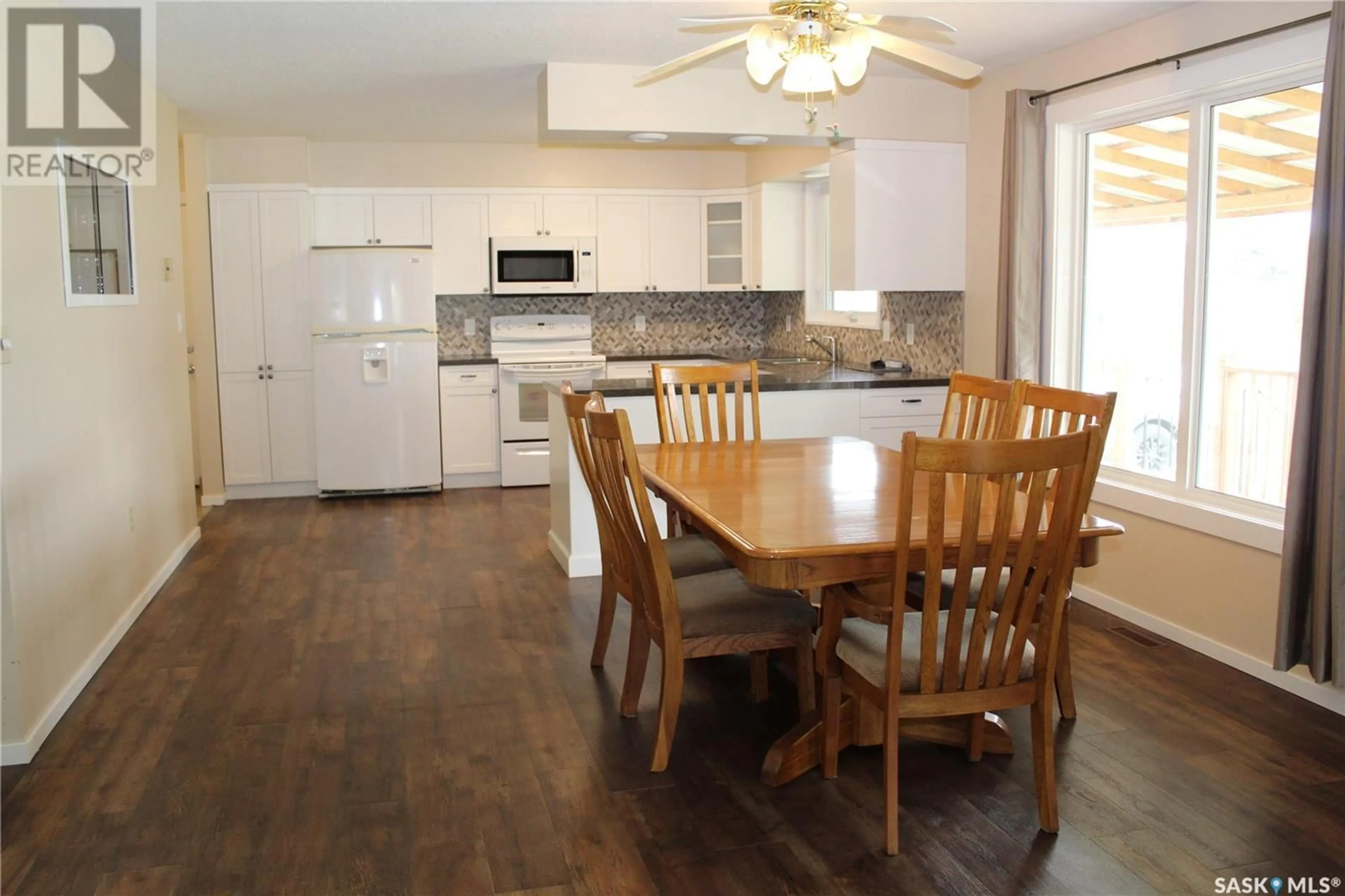 Open concept kitchen, wood/laminate floor for 618 2ND AVENUE, Cudworth Saskatchewan S0K1B0
