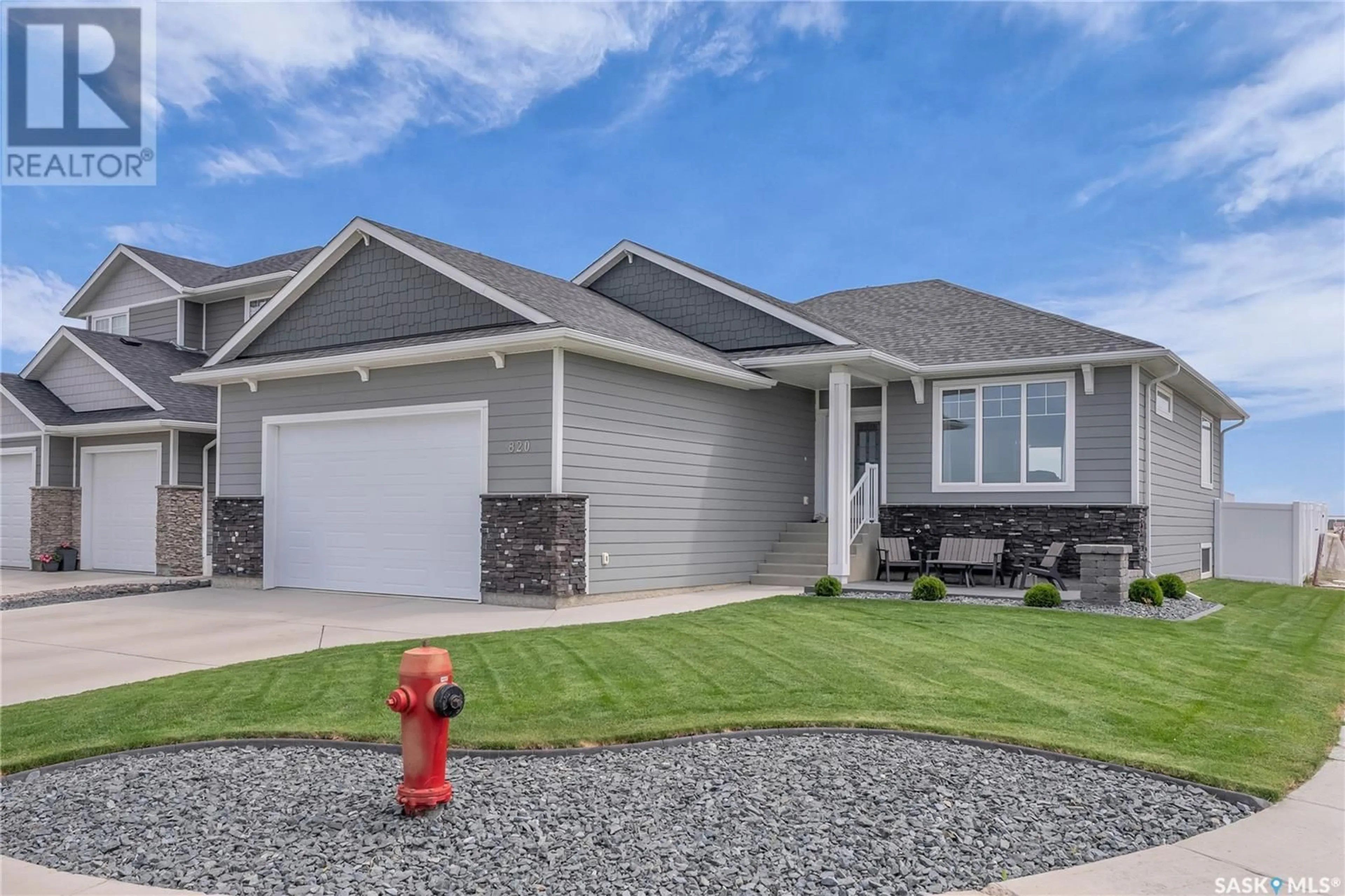 Home with vinyl exterior material, street for 820 1ST AVENUE, Warman Saskatchewan S0K4S5