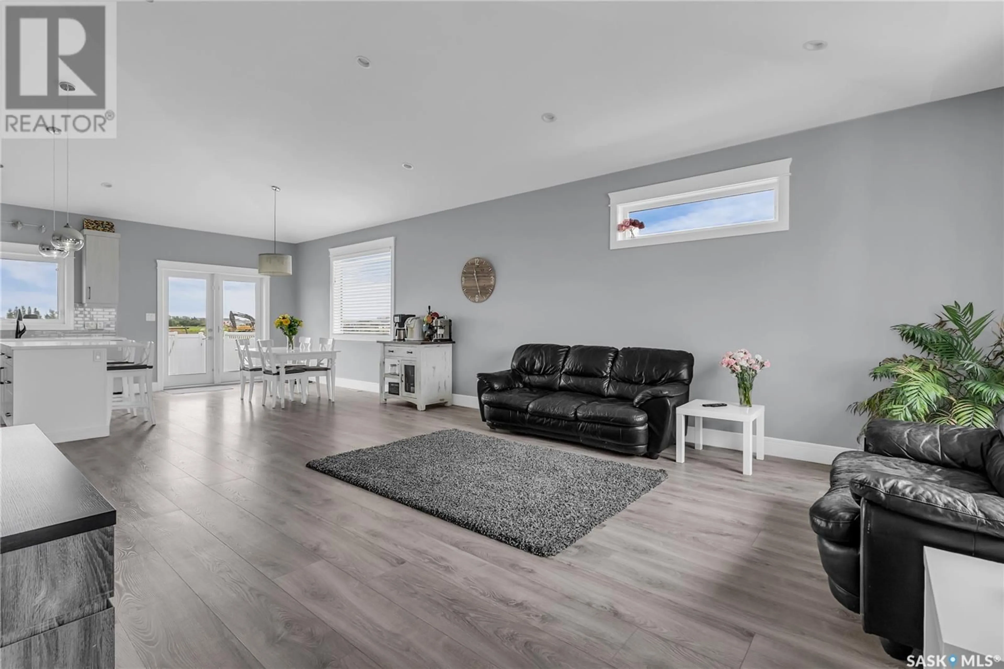 Living room with furniture, wood/laminate floor for 820 1ST AVENUE, Warman Saskatchewan S0K4S5