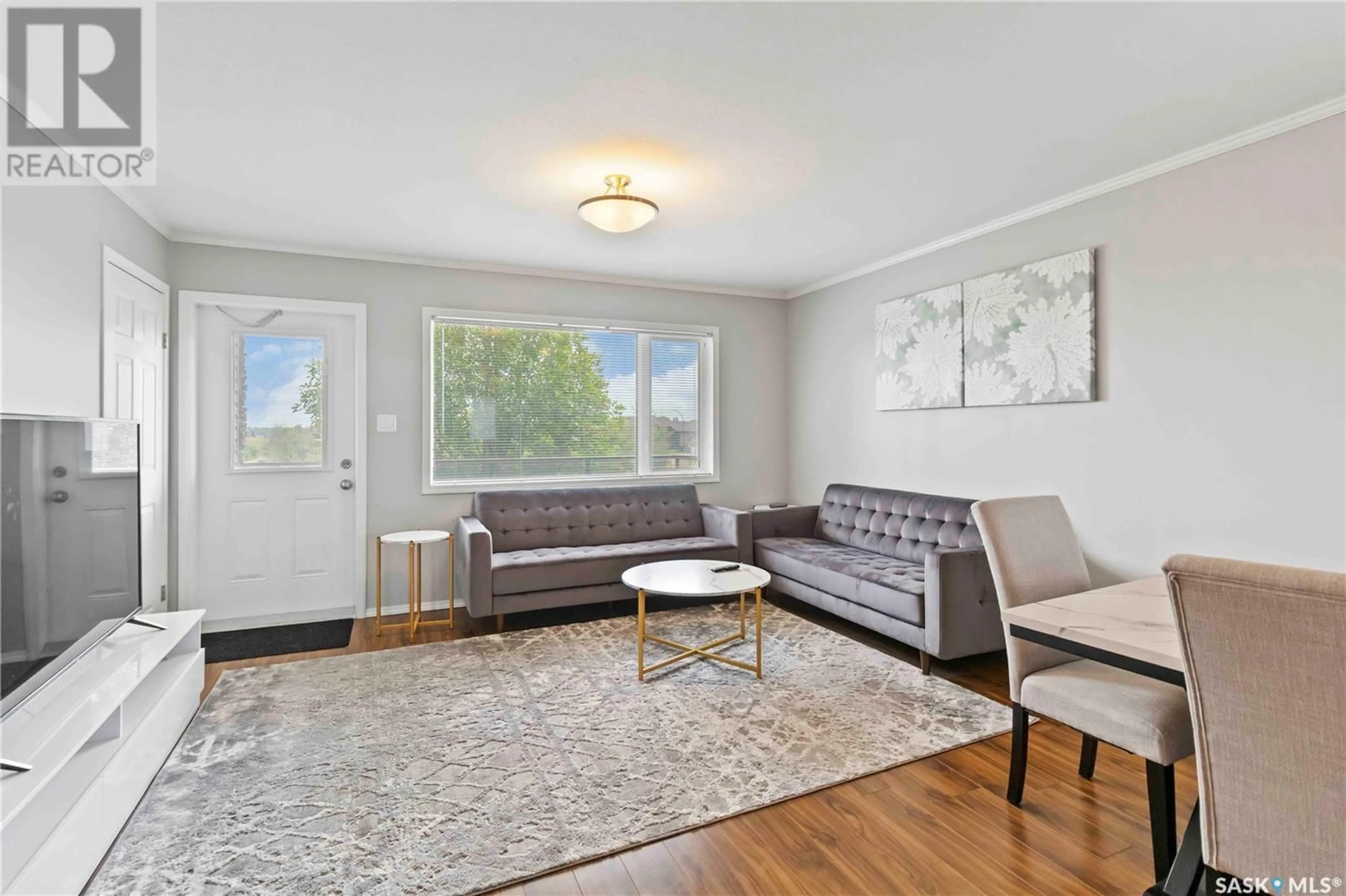 Living room with furniture, wood/laminate floor for 1303 - 612 RICHARDSON ROAD, Saskatoon Saskatchewan S7R0L1