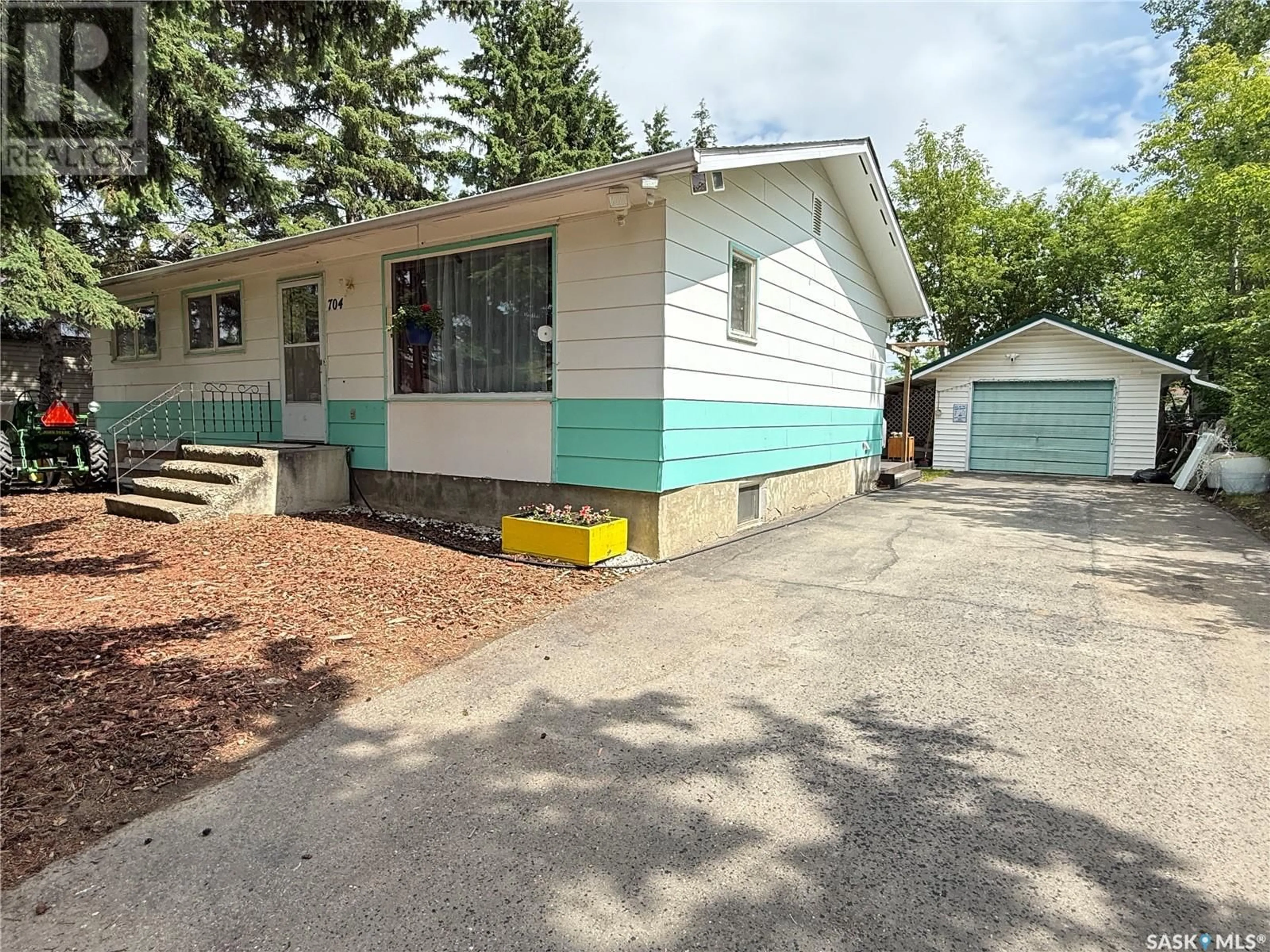 Home with vinyl exterior material, street for 704 1ST AVENUE, Loon Lake Saskatchewan S0M1L0