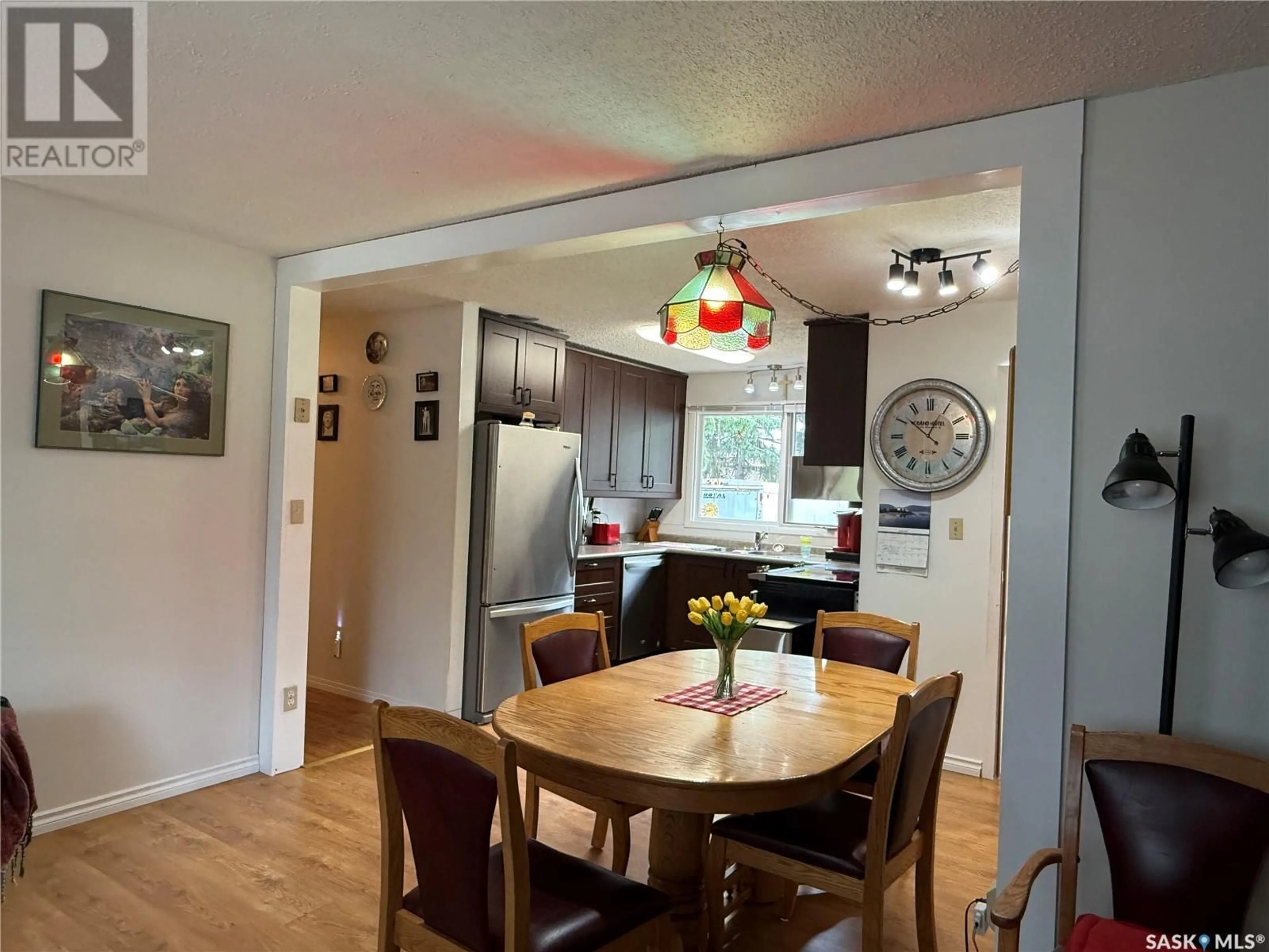 Dining room, wood/laminate floor for 704 1ST AVENUE, Loon Lake Saskatchewan S0M1L0
