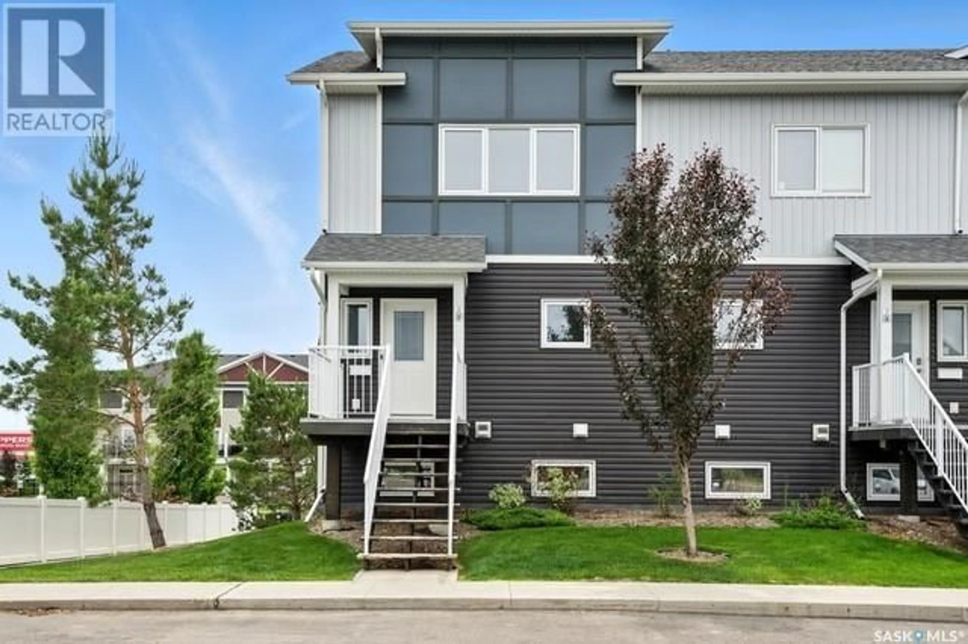 Home with vinyl exterior material, street for 302 225 HASSARD CLOSE, Saskatoon Saskatchewan S7L2W8