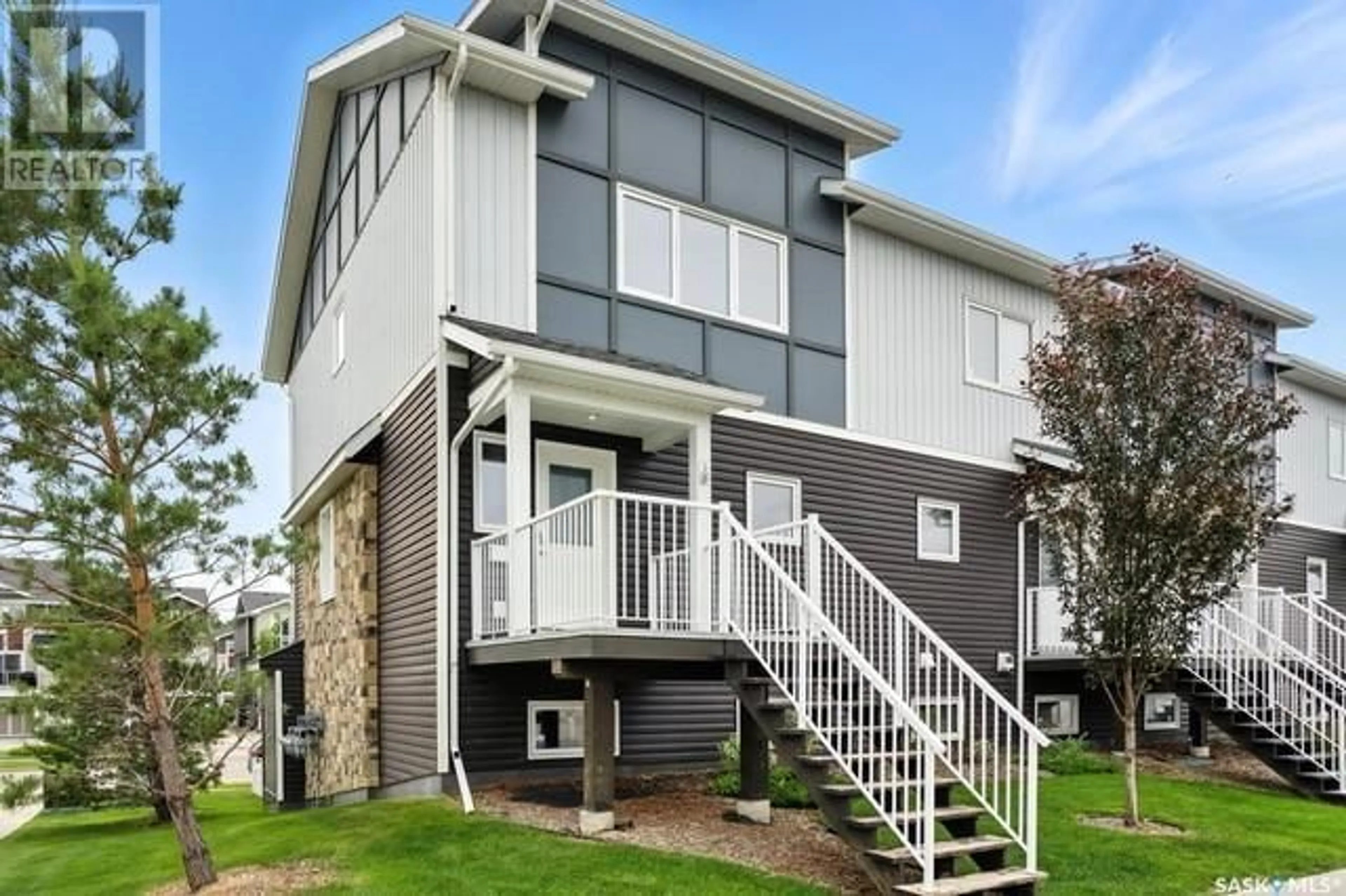 Home with vinyl exterior material, street for 302 225 HASSARD CLOSE, Saskatoon Saskatchewan S7L2W8
