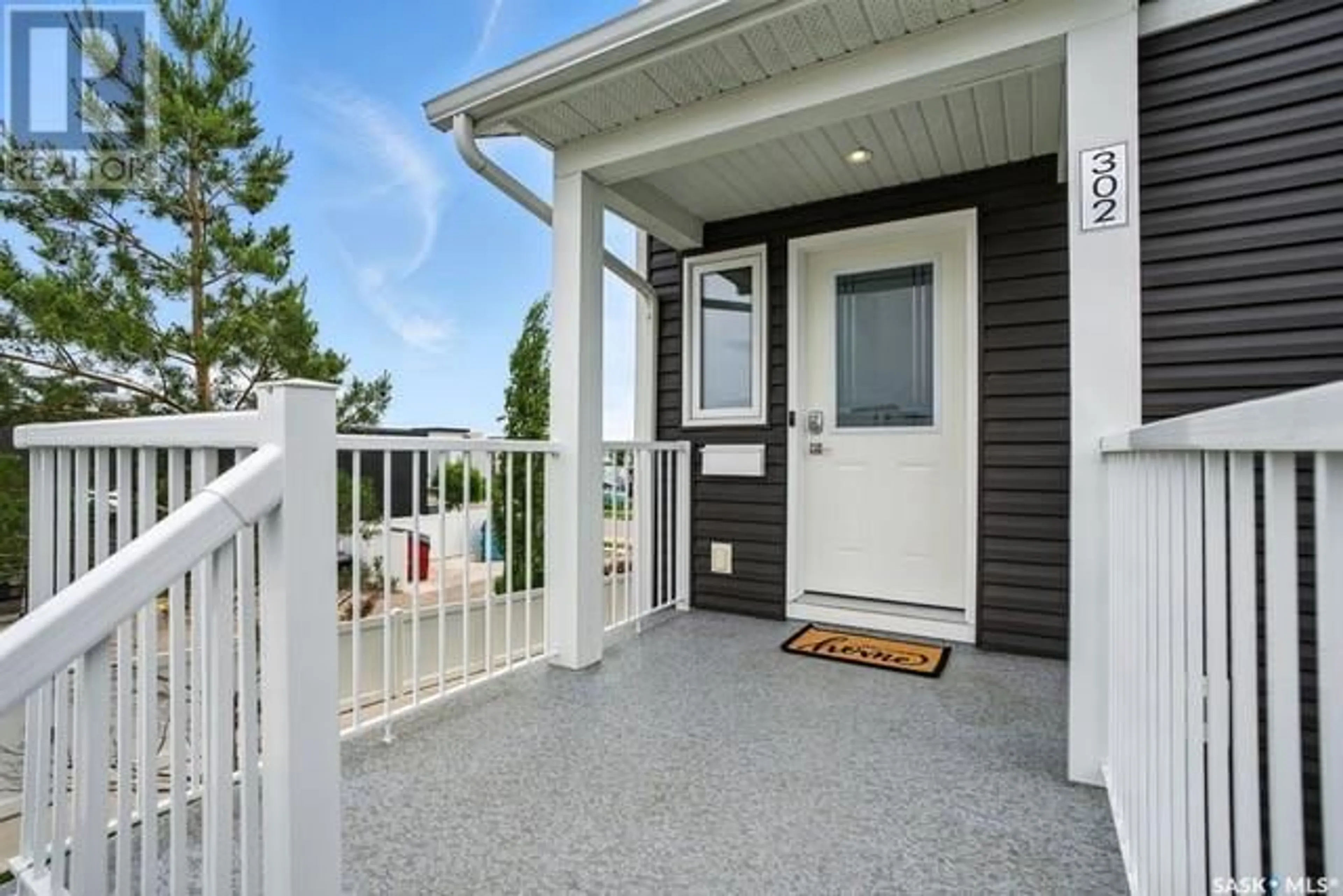 Home with vinyl exterior material, street for 302 225 HASSARD CLOSE, Saskatoon Saskatchewan S7L2W8