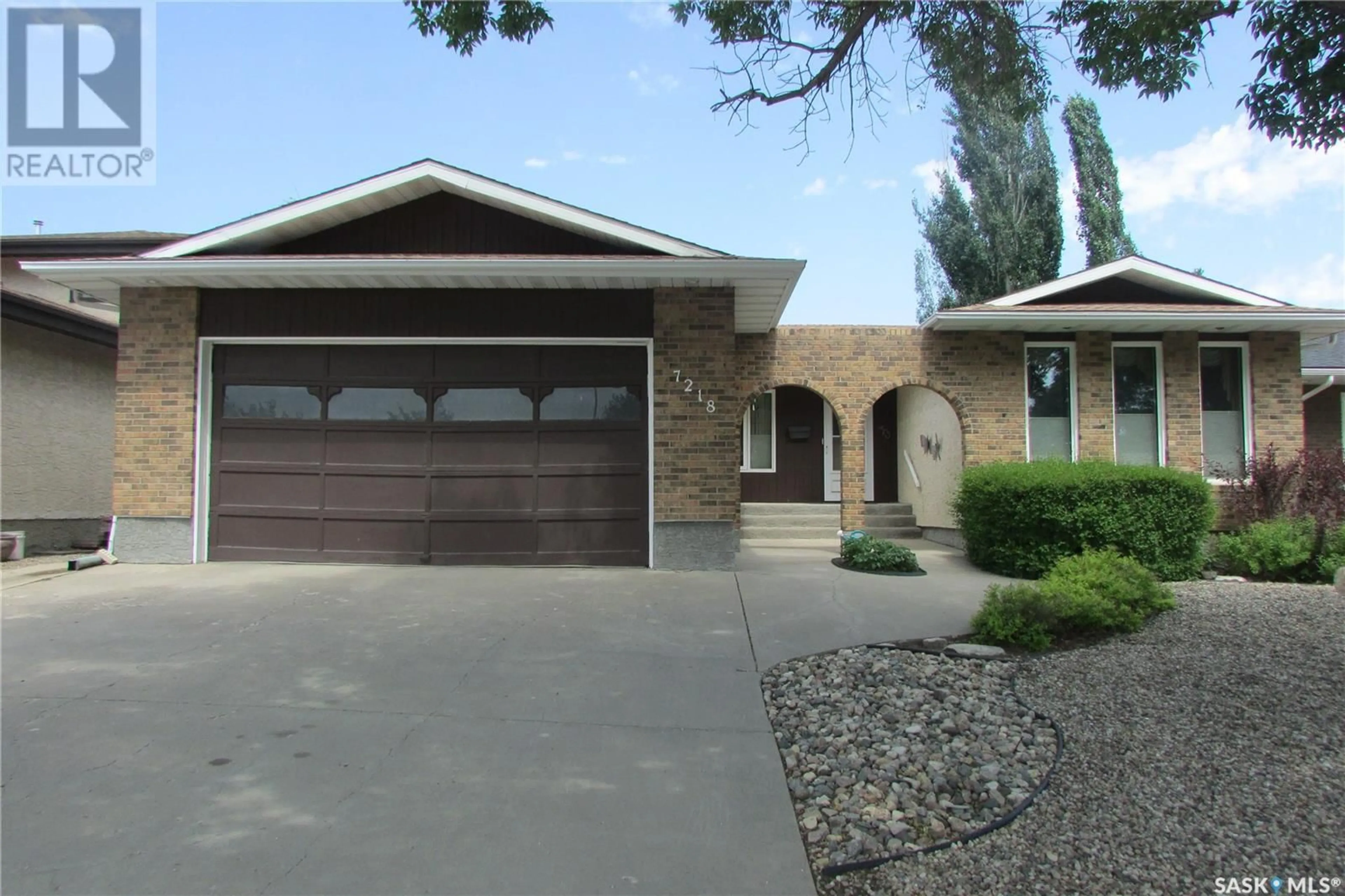 Home with vinyl exterior material, street for 7218 SHERWOOD DRIVE, Regina Saskatchewan S4X2Y3