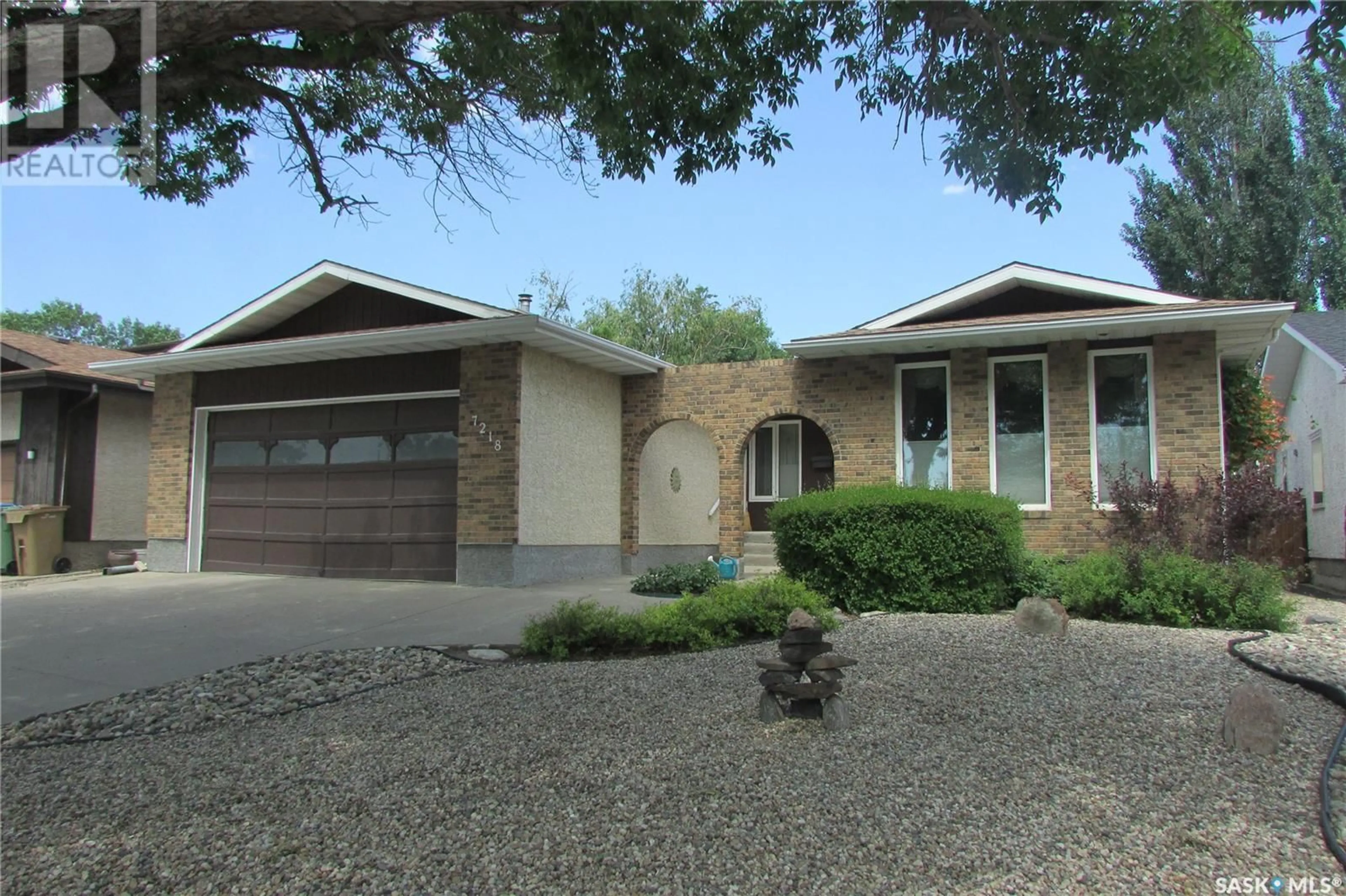Home with vinyl exterior material, street for 7218 SHERWOOD DRIVE, Regina Saskatchewan S4X2Y3