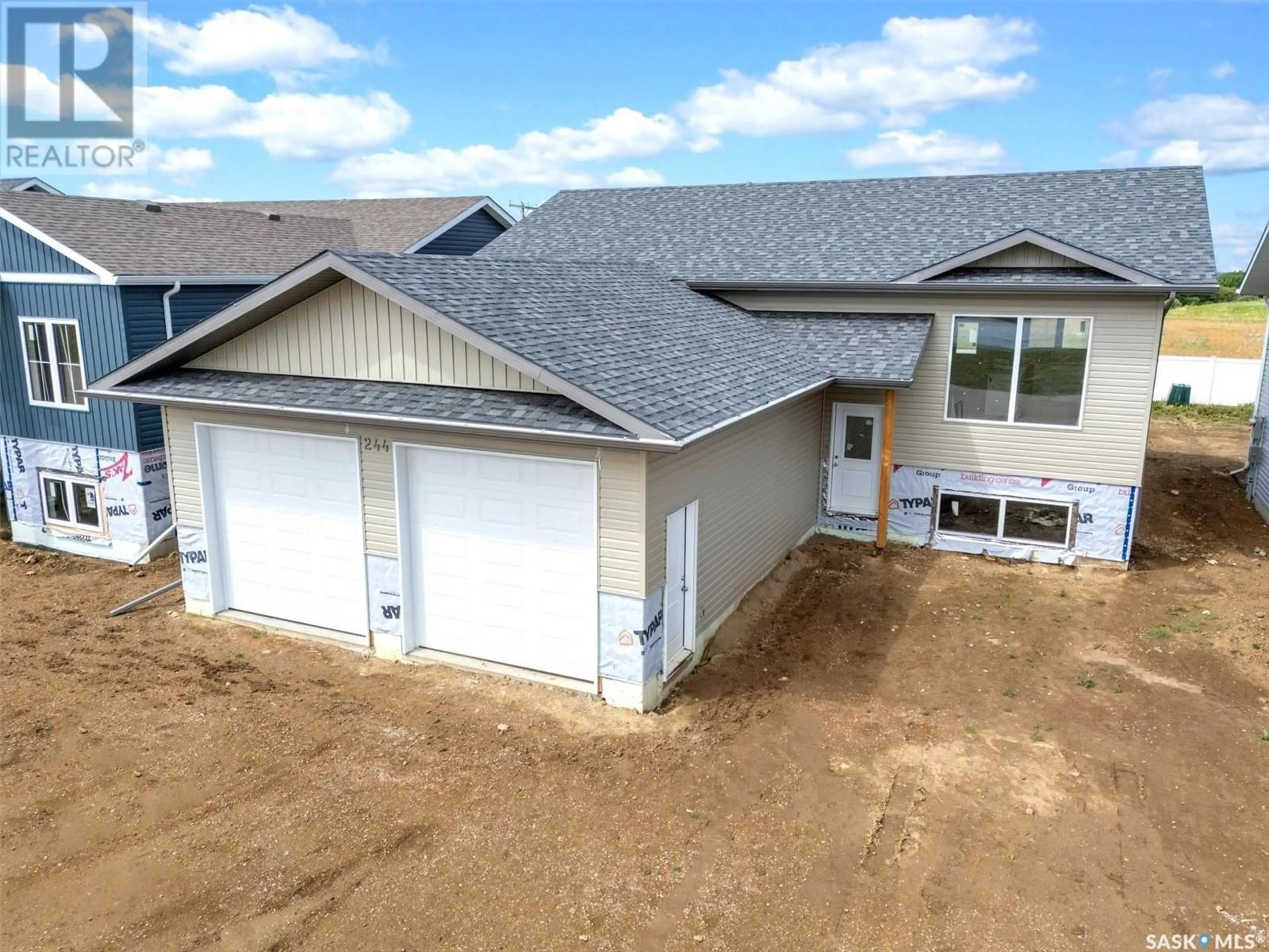 A pic from outside/outdoor area/front of a property/back of a property/a pic from drone, building for 244 PRAIRIE DAWN DRIVE, Dundurn Saskatchewan S0K1K1