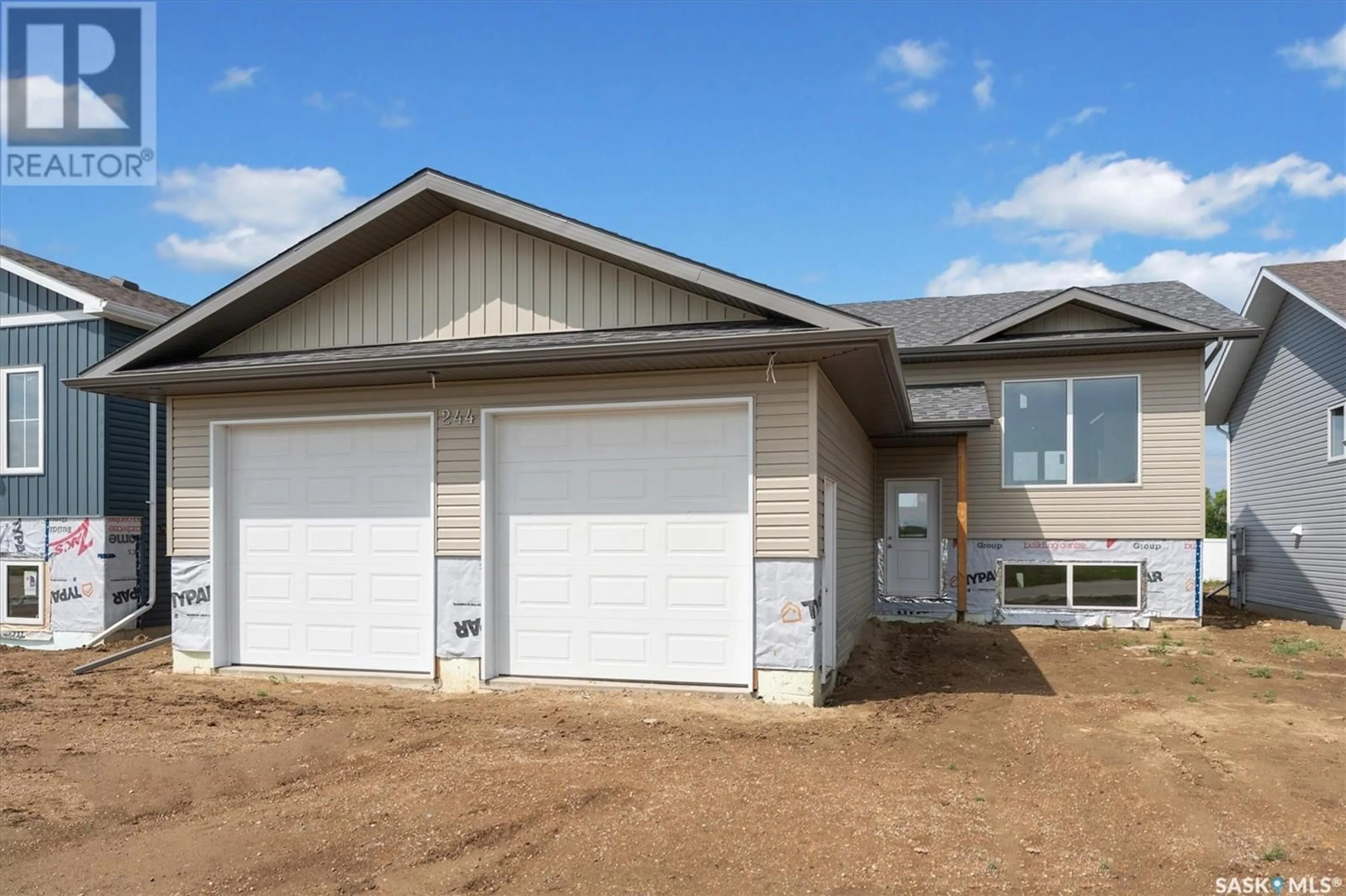 Home with vinyl exterior material, street for 244 PRAIRIE DAWN DRIVE, Dundurn Saskatchewan S0K1K1
