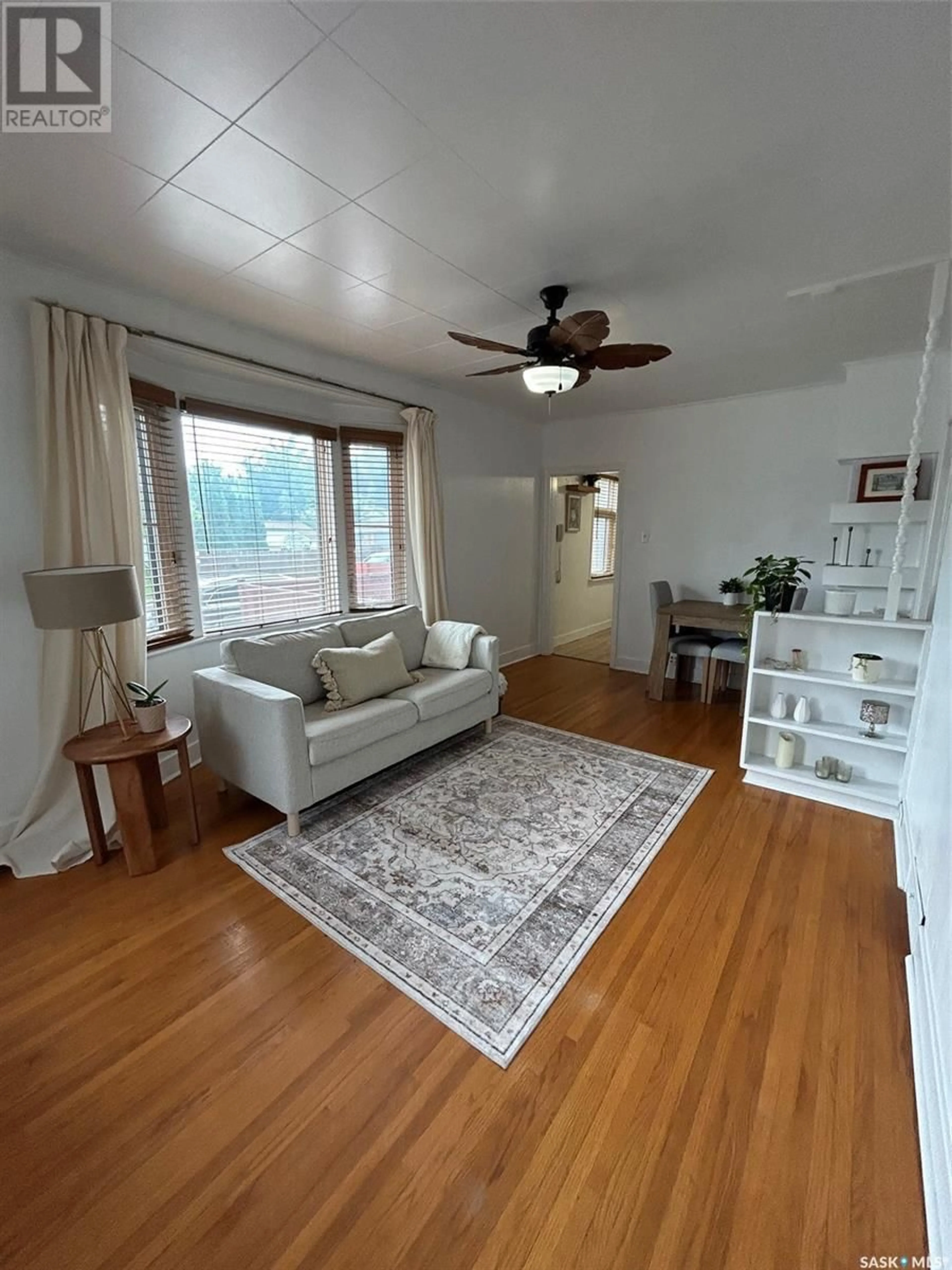 Living room with furniture, wood/laminate floor for 2178 WALLACE STREET, Regina Saskatchewan S4N4A5