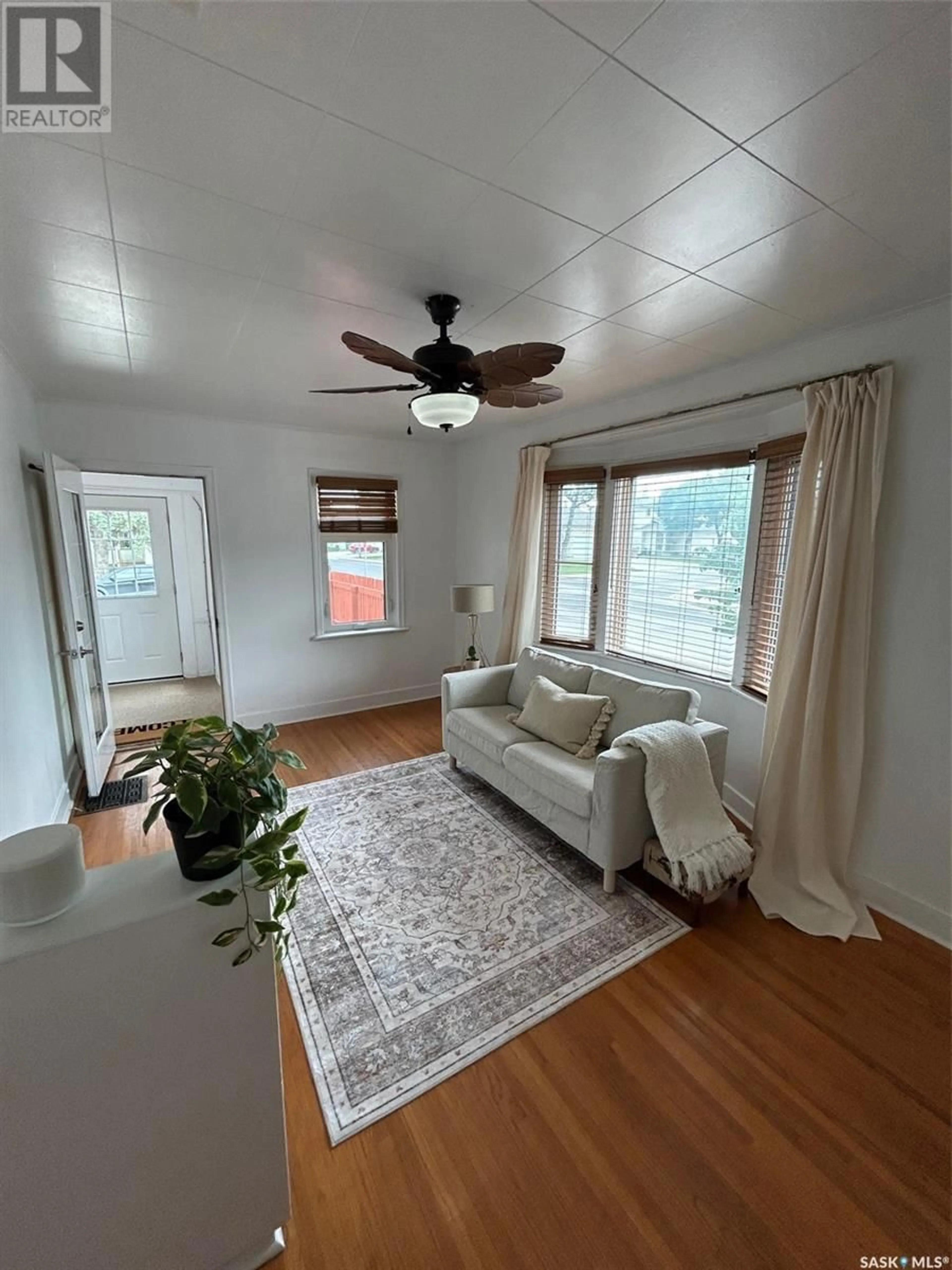 Living room with furniture, wood/laminate floor for 2178 WALLACE STREET, Regina Saskatchewan S4N4A5