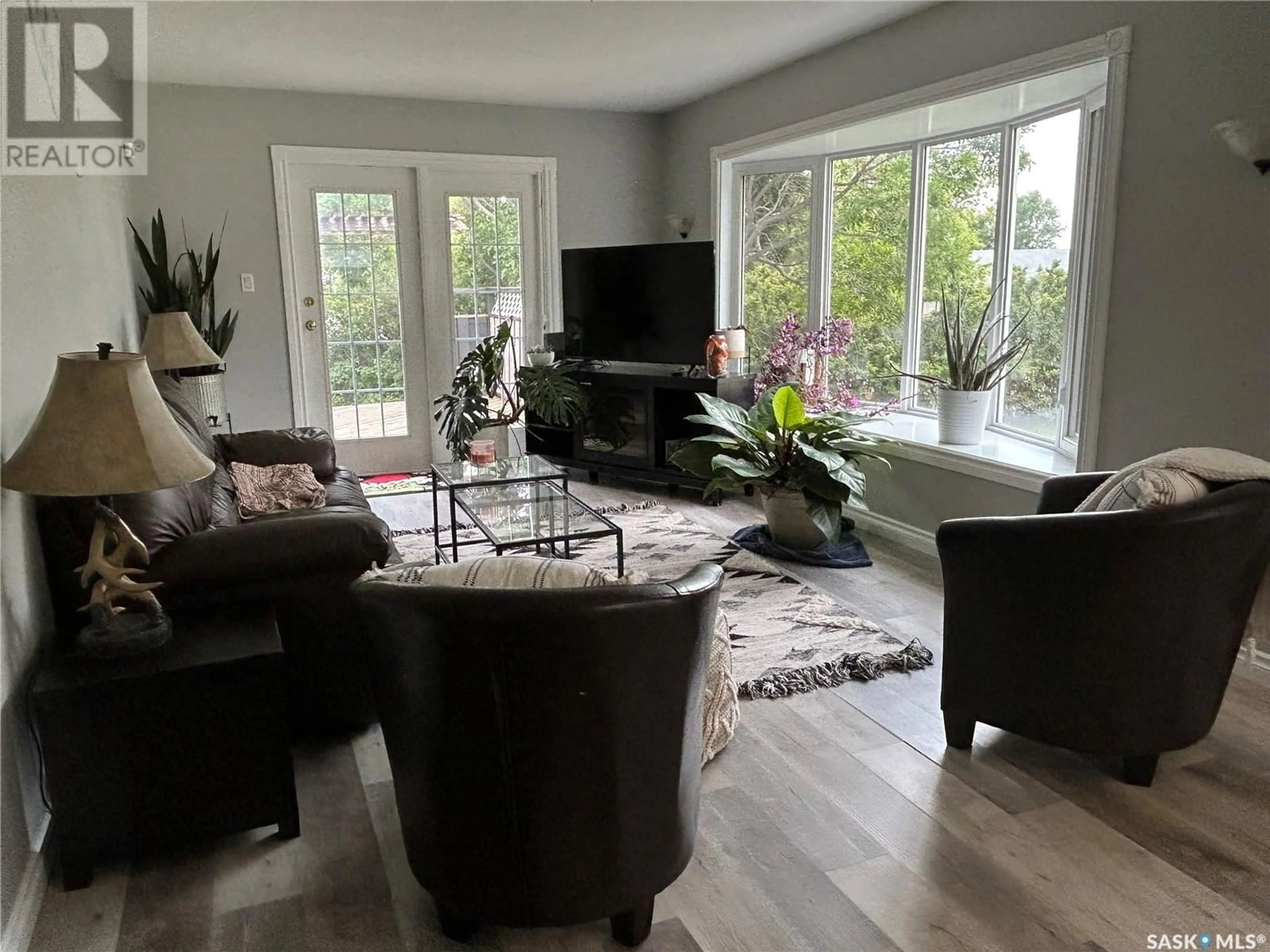 Living room with furniture, wood/laminate floor for 516 FIRST AVENUE, Lampman Saskatchewan S0C1N0