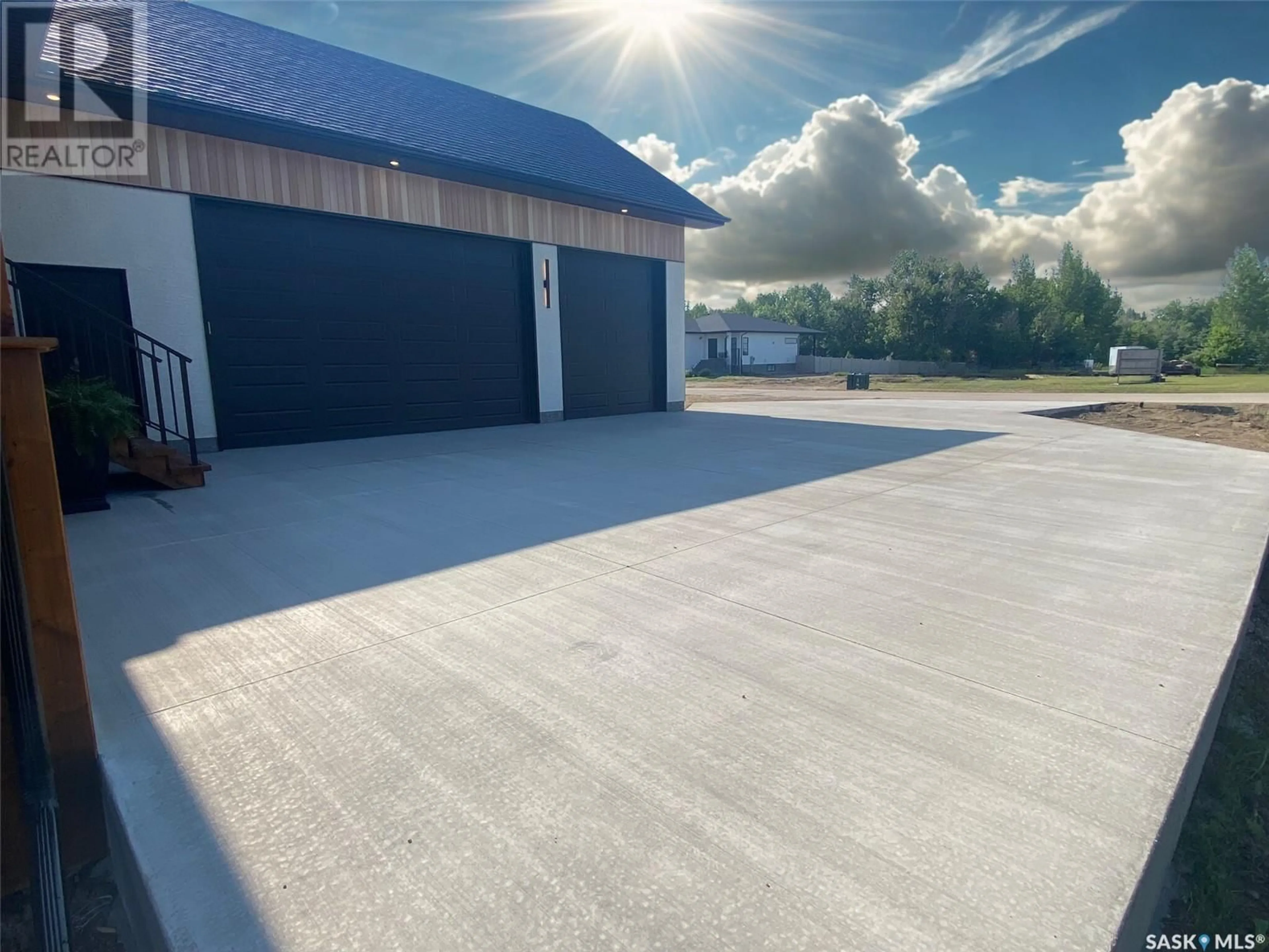 A pic from outside/outdoor area/front of a property/back of a property/a pic from drone, street for 1 SARAH'S COVE, White City Saskatchewan S4L0E2