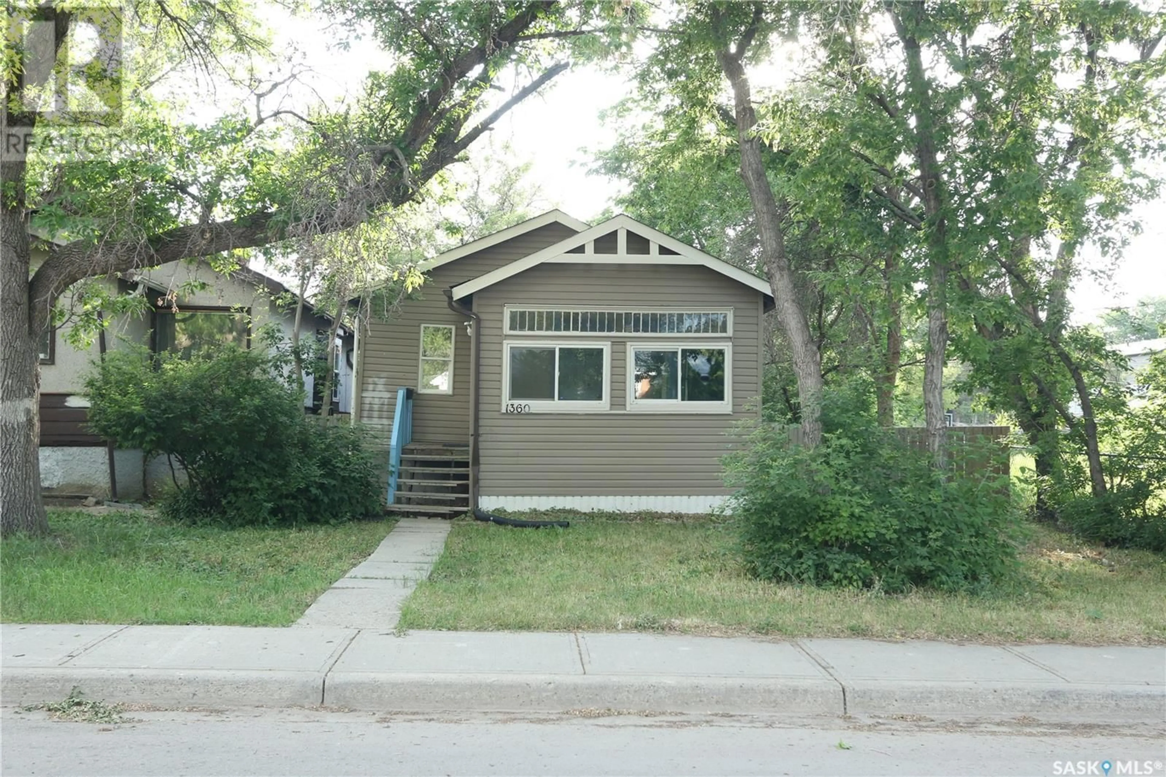 Home with vinyl exterior material, street for 1360 ATHOL STREET, Regina Saskatchewan S4T3C5