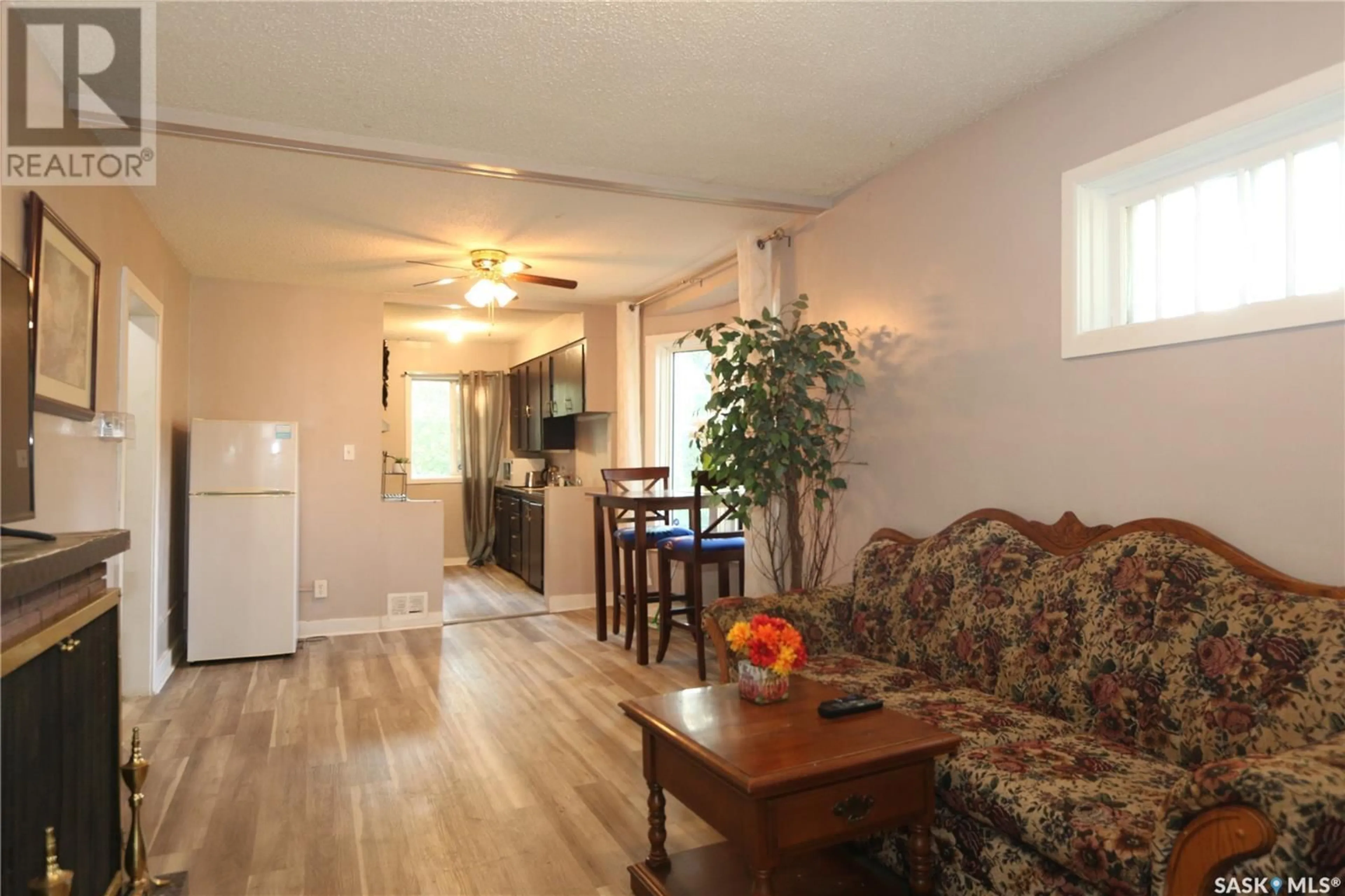 Living room with furniture, wood/laminate floor for 1360 ATHOL STREET, Regina Saskatchewan S4T3C5