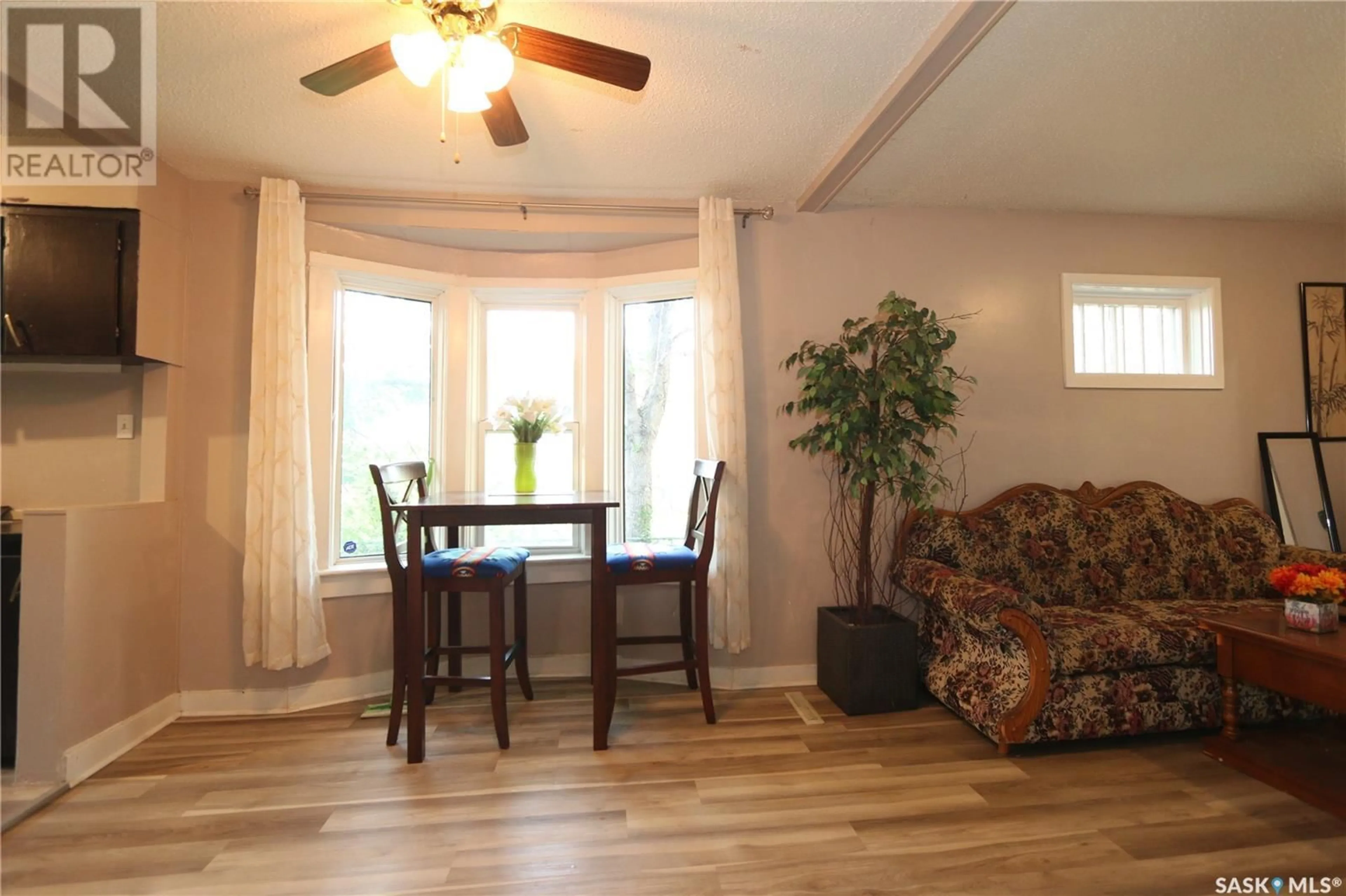 Living room with furniture, wood/laminate floor for 1360 ATHOL STREET, Regina Saskatchewan S4T3C5