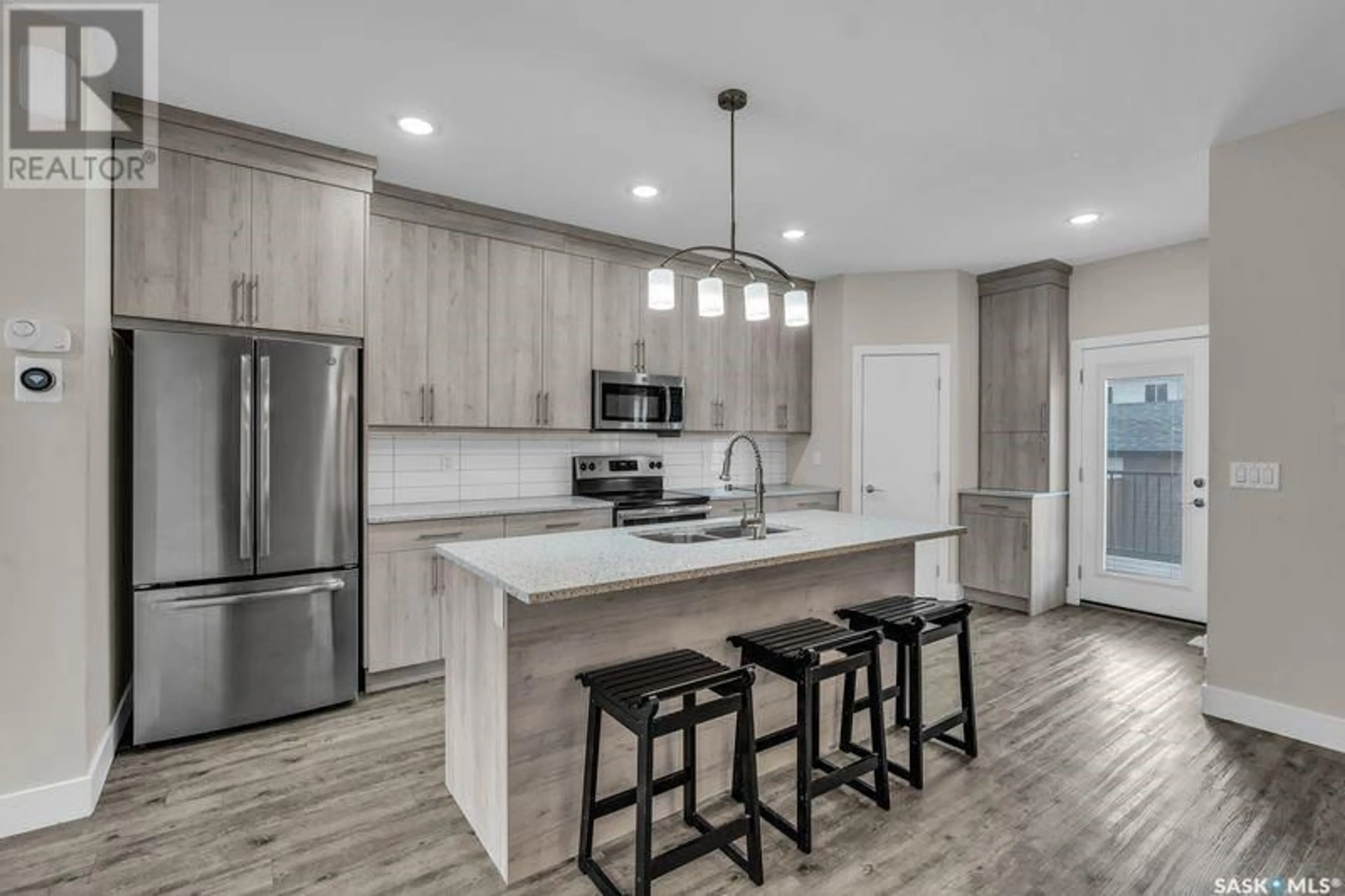 Open concept kitchen, unknown for 685 FEHEREGYHAZI BOULEVARD, Saskatoon Saskatchewan S7W0Y3