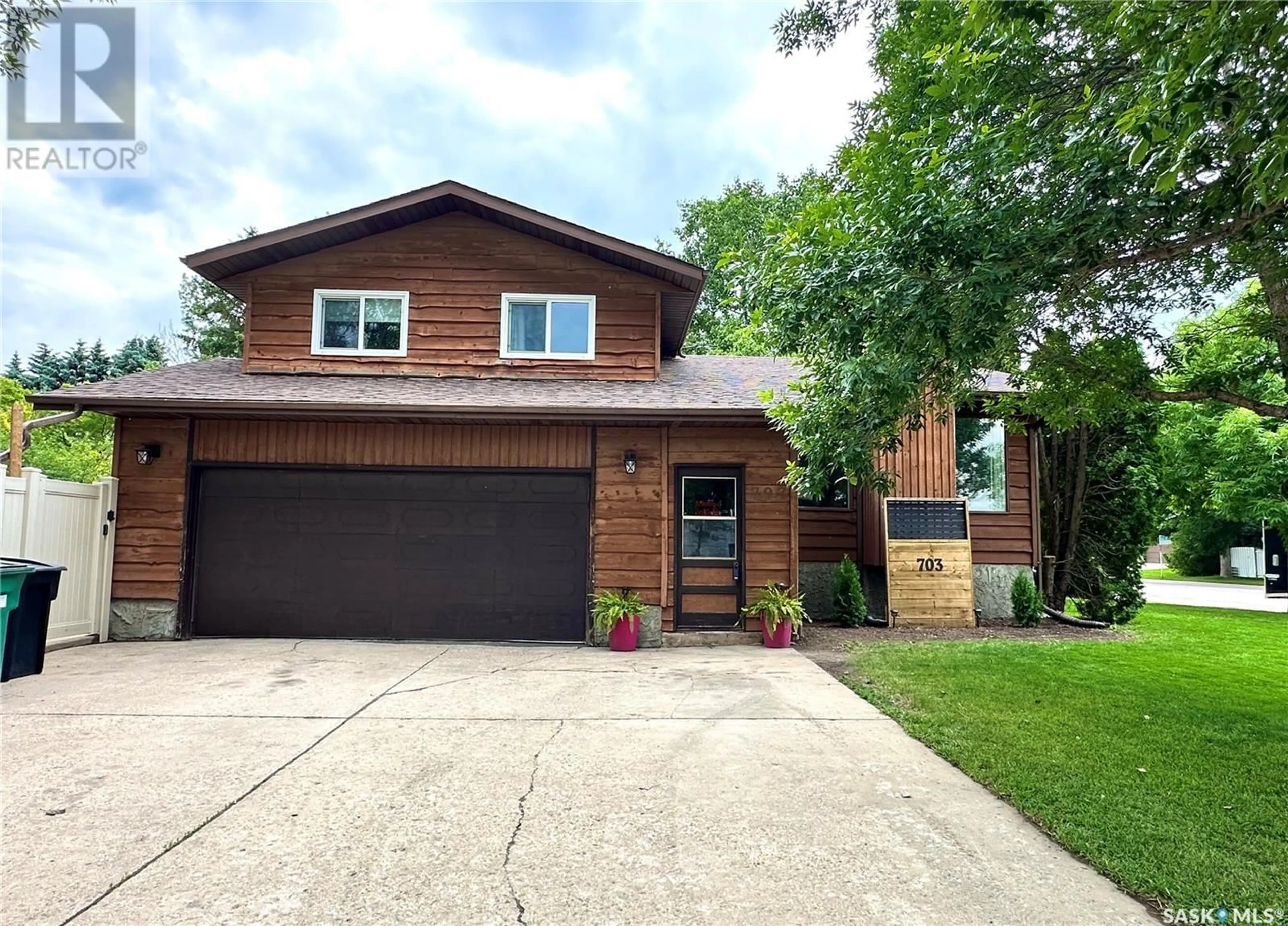 Home with brick exterior material, street for 703 MCCORMACK ROAD, Saskatoon Saskatchewan S7M5B9
