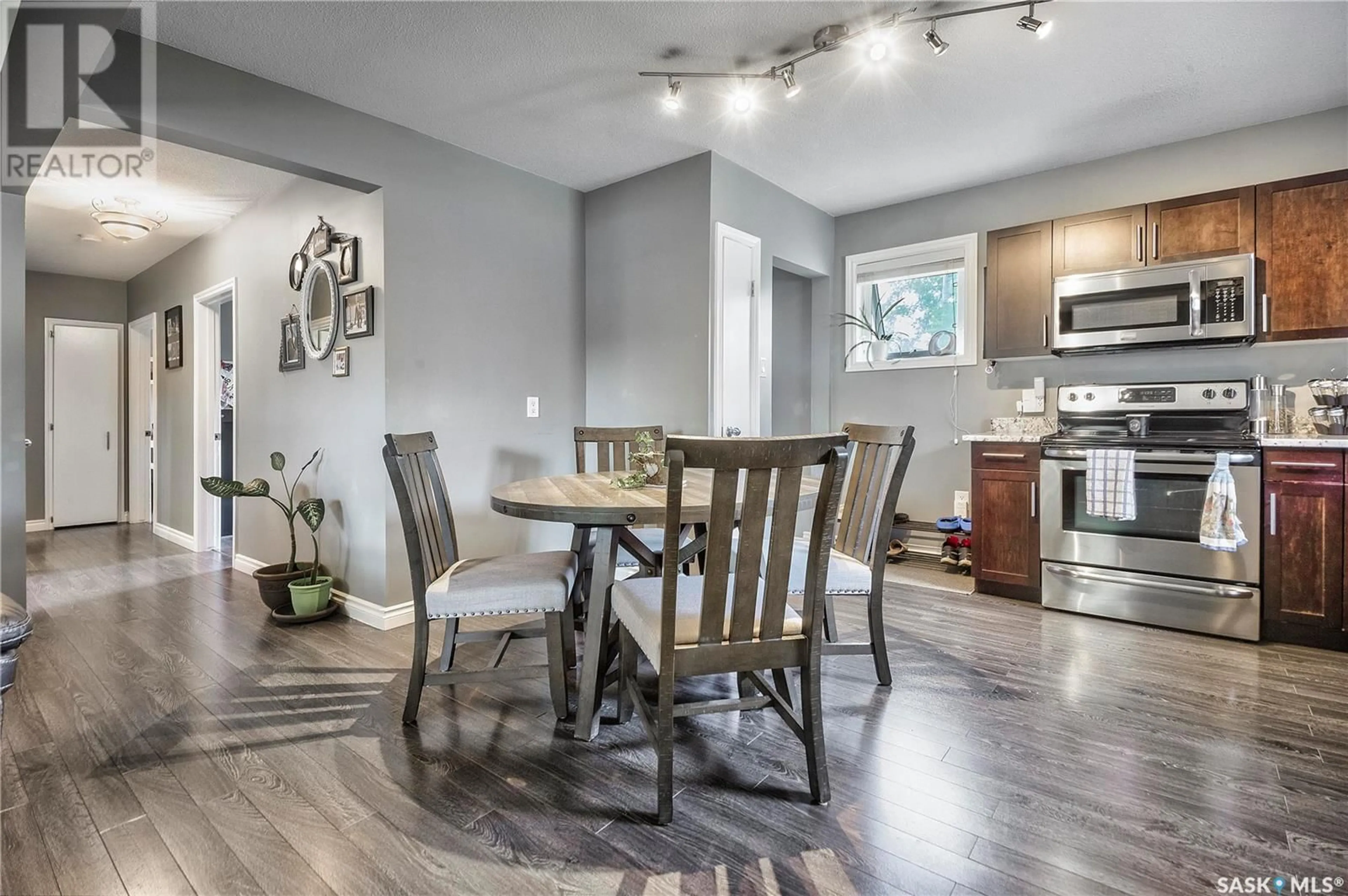 Open concept kitchen, wood/laminate floor for 341 23RD STREET, Prince Albert Saskatchewan S6V4L9