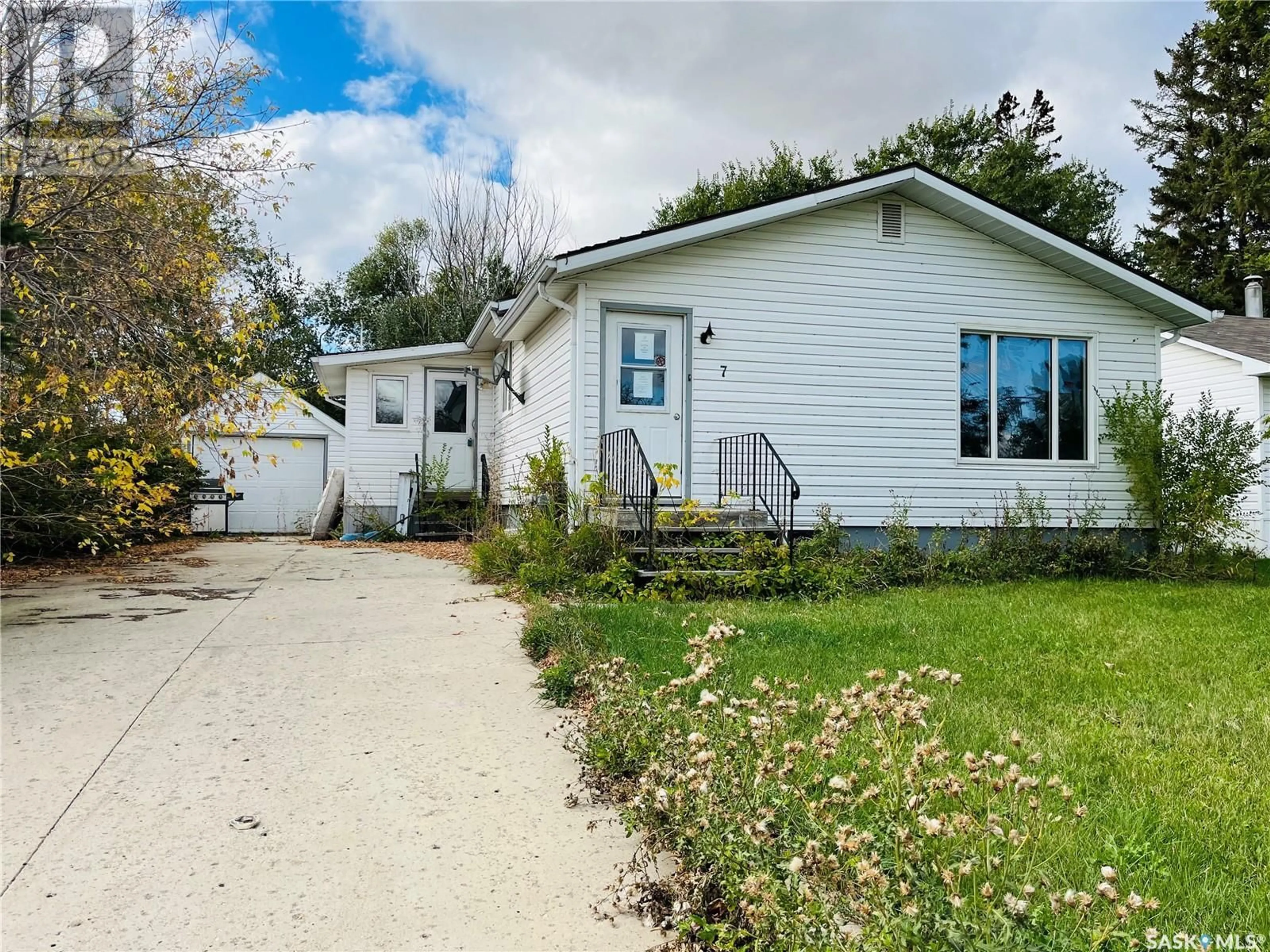 Home with vinyl exterior material, street for 7 WAUCHOPE STREET, Redvers Saskatchewan S0C2H0