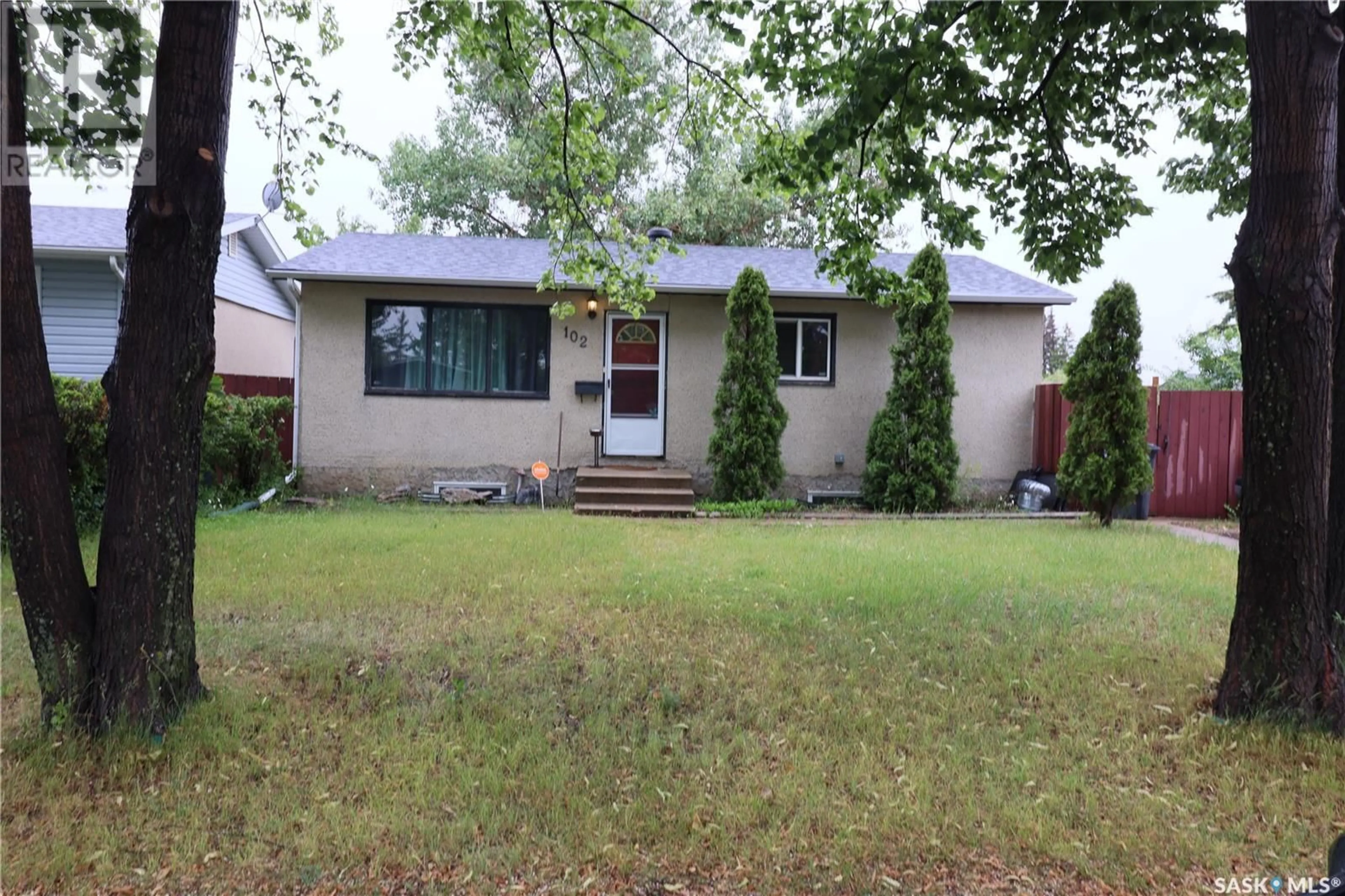 Home with vinyl exterior material, street for 102 DOUGLAS CRESCENT, Saskatoon Saskatchewan S7L4S8