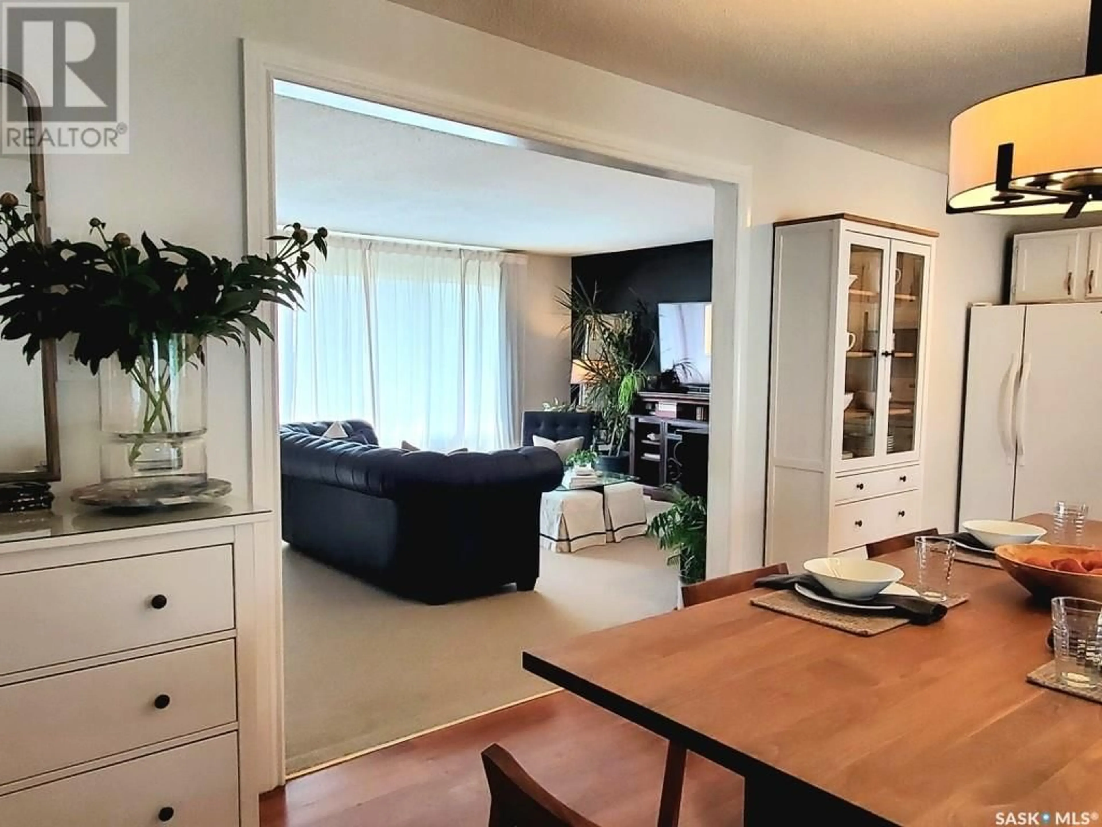 Living room with furniture, wood/laminate floor for 1529 CENTRAL AVENUE, Saskatoon Saskatchewan S7N2H3