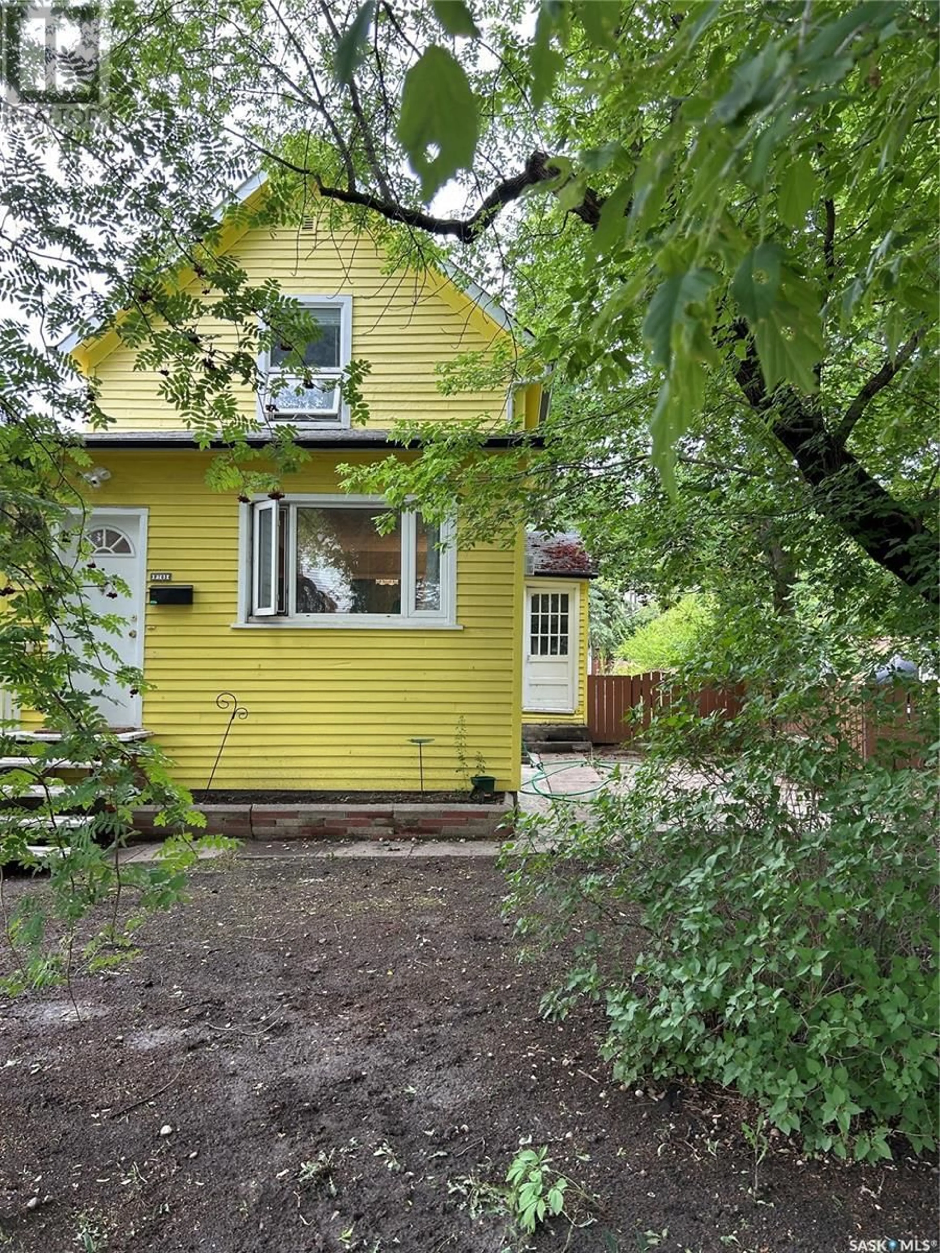 Home with vinyl exterior material, street for 703 7TH STREET, Saskatoon Saskatchewan S7H0Y1