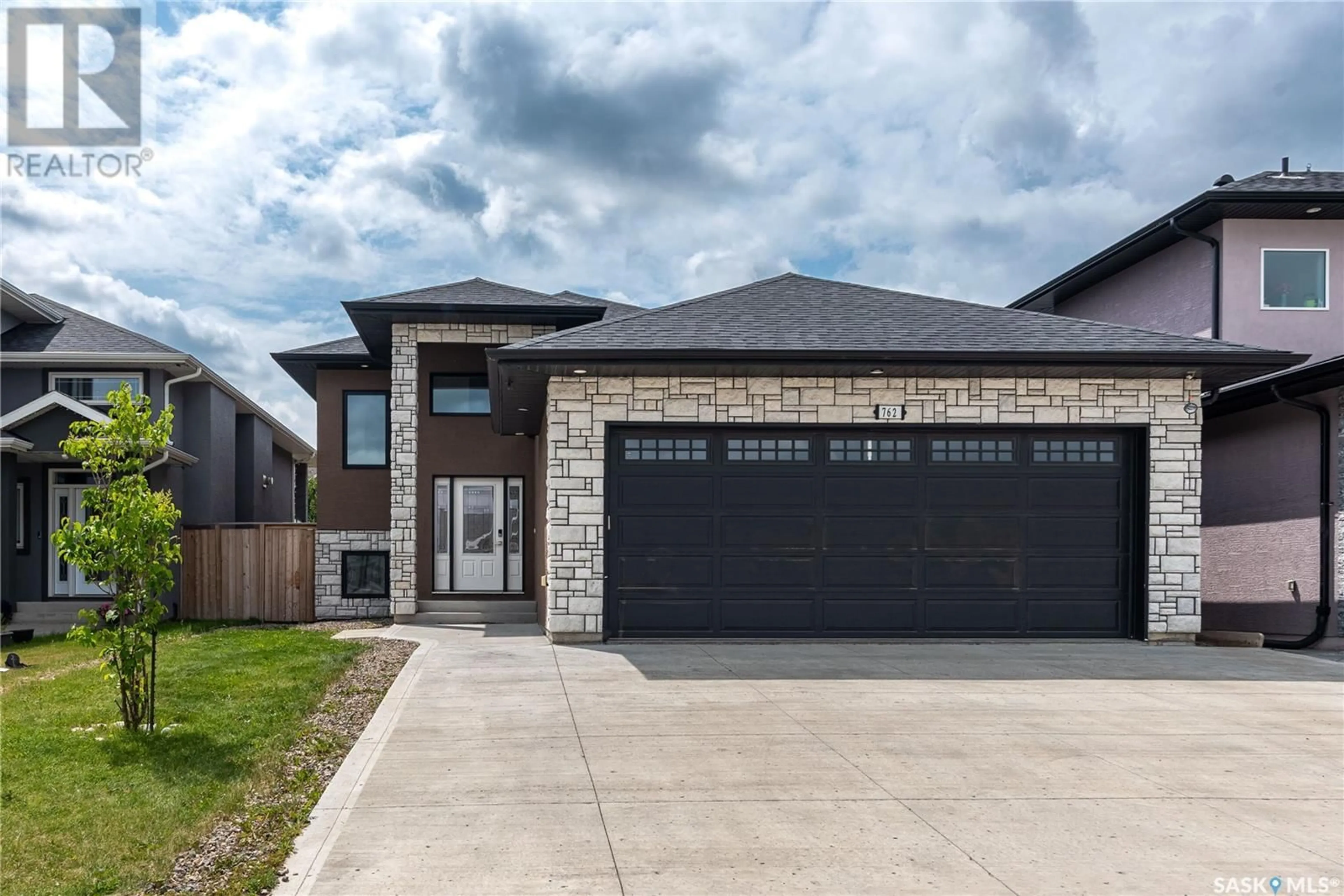 Home with brick exterior material, street for 762 LABINE COURT, Saskatoon Saskatchewan S7L6C8