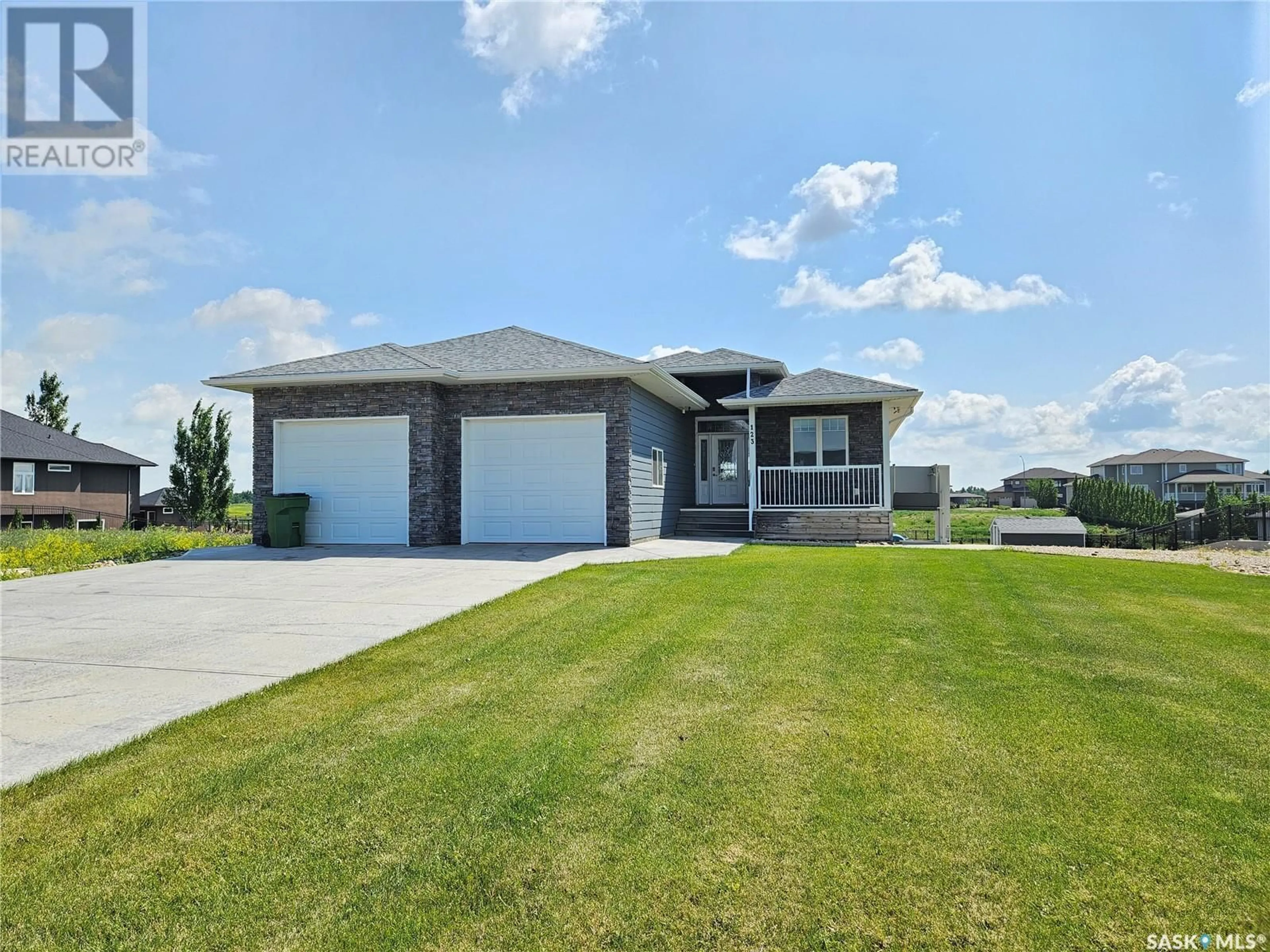 Home with brick exterior material, street for 123 IRON BRIDGE DRIVE, Moose Jaw Saskatchewan S6J0B4