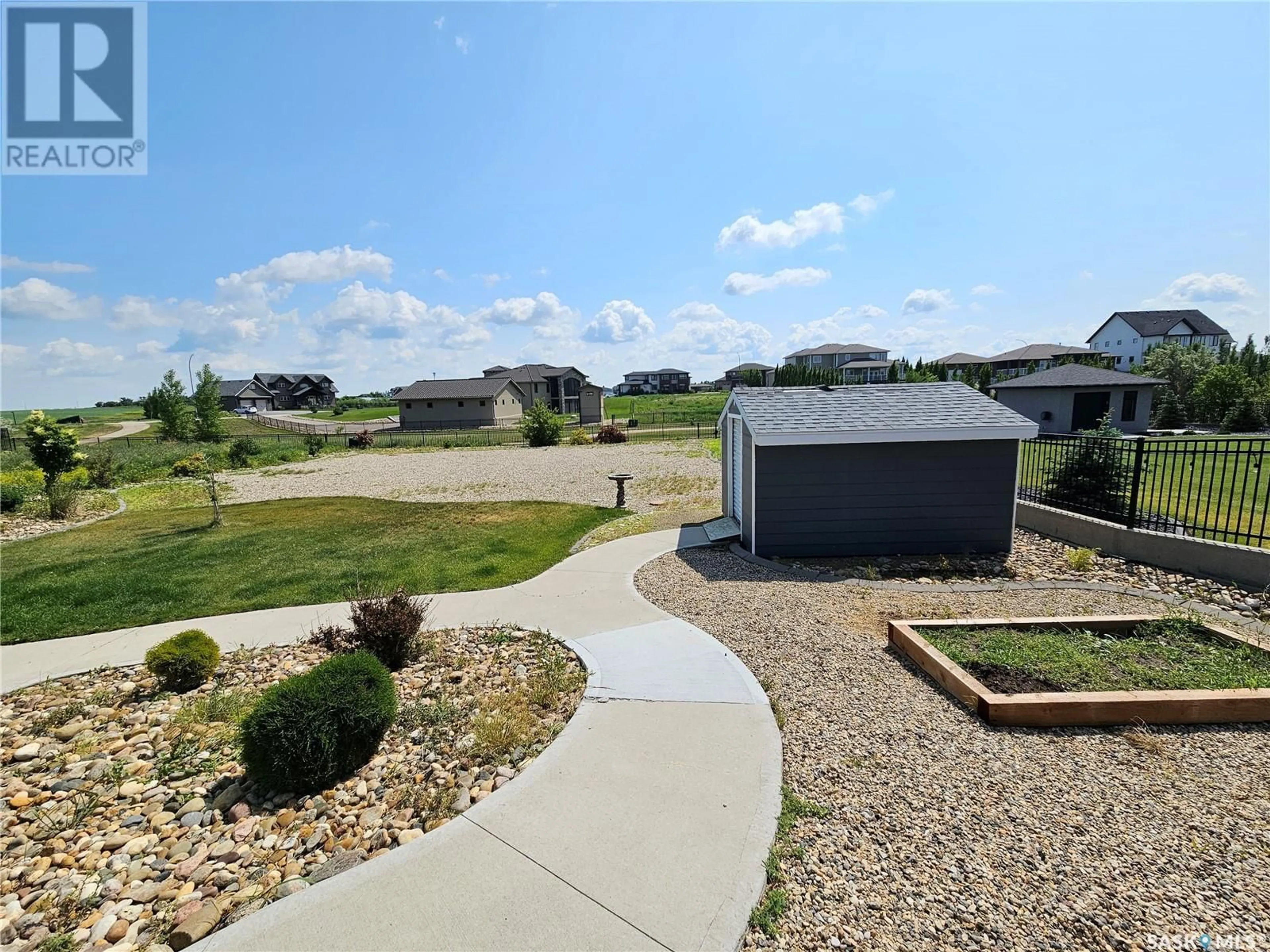 A pic from outside/outdoor area/front of a property/back of a property/a pic from drone, street for 123 IRON BRIDGE DRIVE, Moose Jaw Saskatchewan S6J0B4