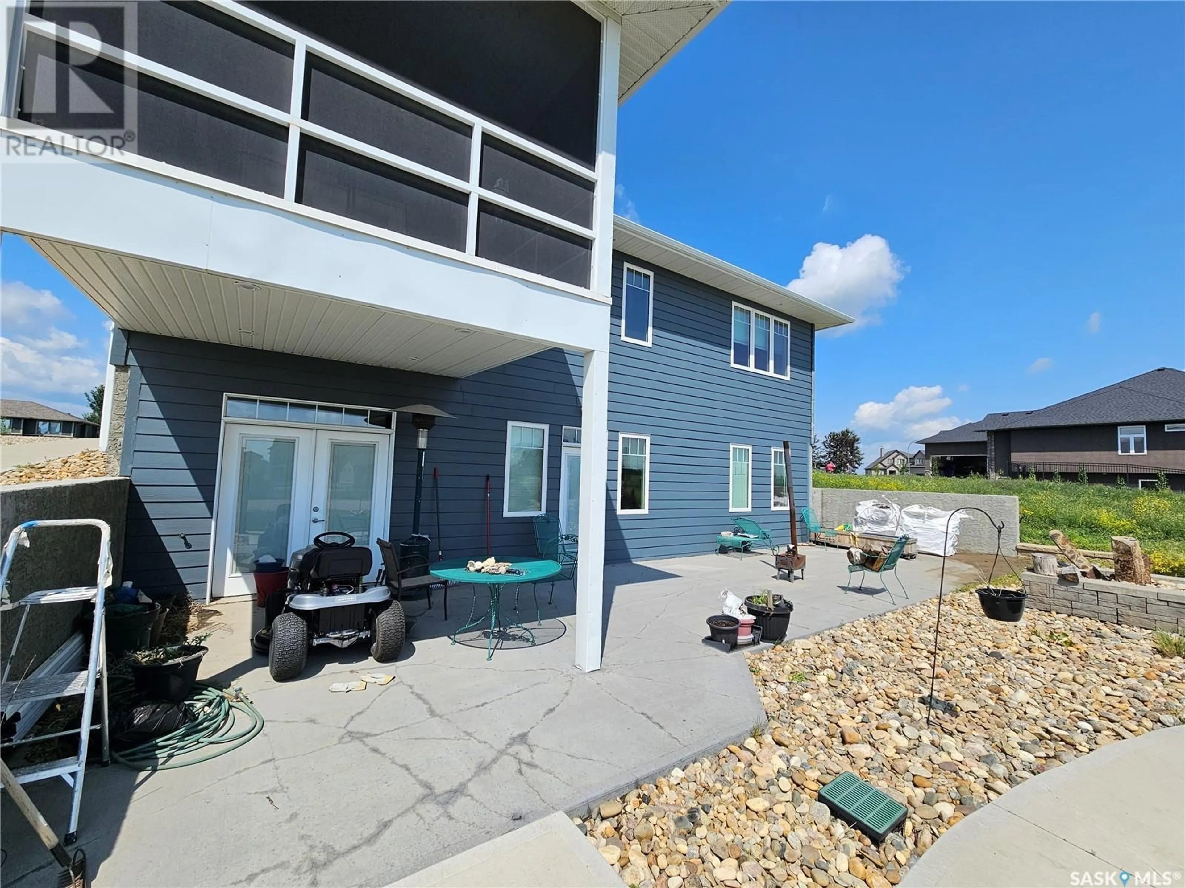 A pic from outside/outdoor area/front of a property/back of a property/a pic from drone, water/lake/river/ocean view for 123 IRON BRIDGE DRIVE, Moose Jaw Saskatchewan S6J0B4
