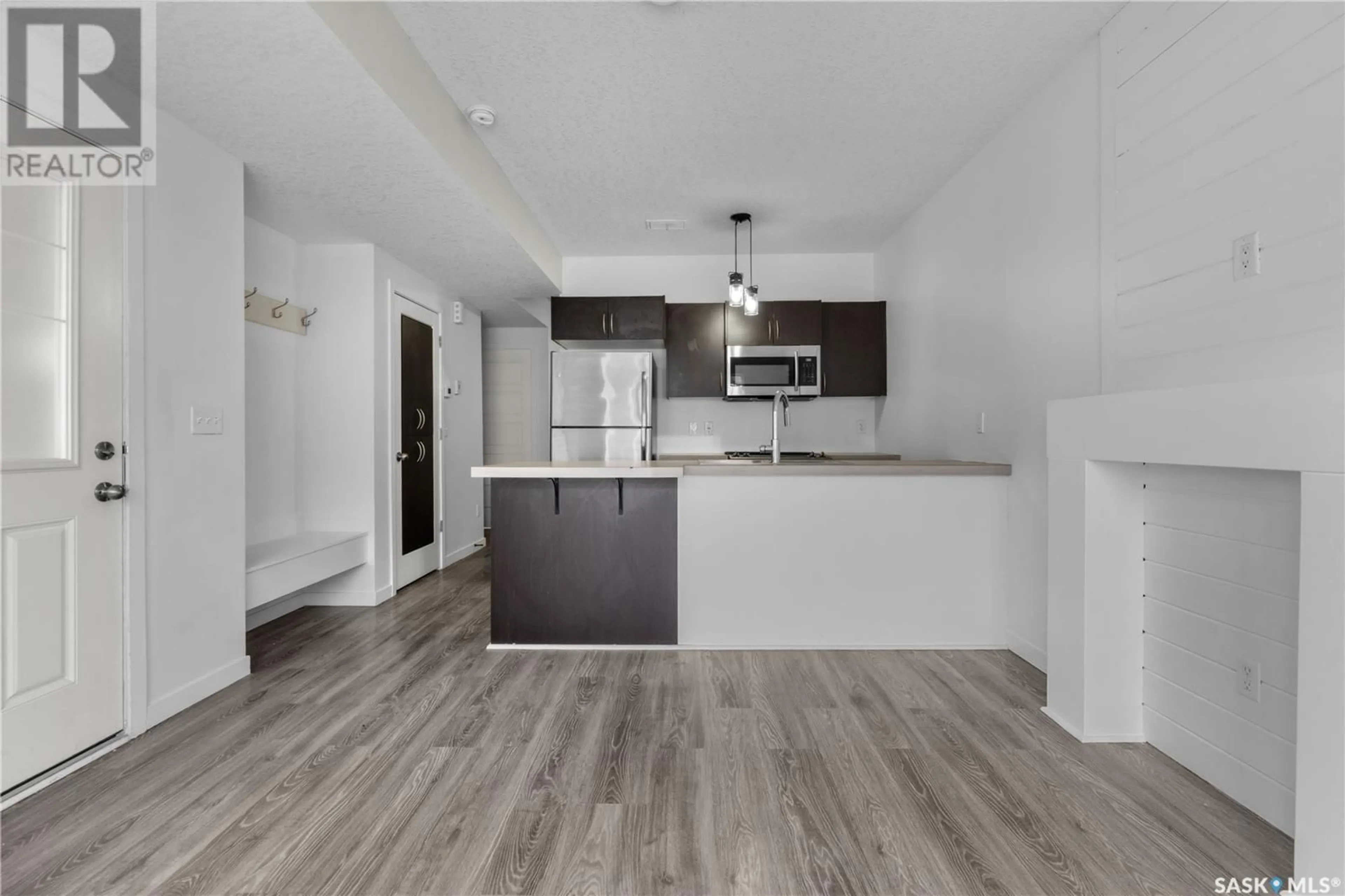 Open concept kitchen, wood/laminate floor for 48A 5635 AERODROME ROAD, Regina Saskatchewan S4W0M3