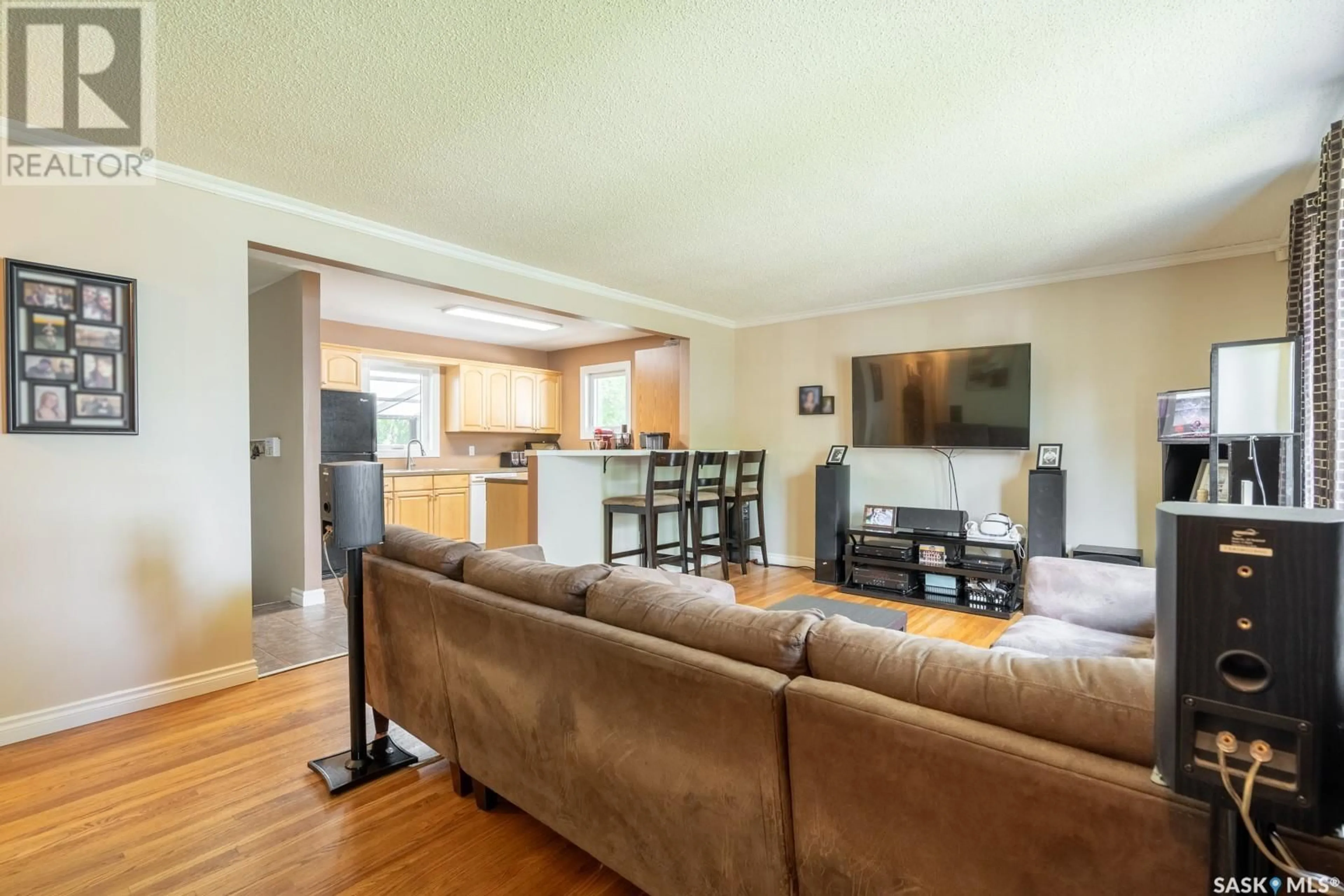 Living room with furniture, wood/laminate floor for 2826 SINTON AVENUE, Regina Saskatchewan S4S1K3