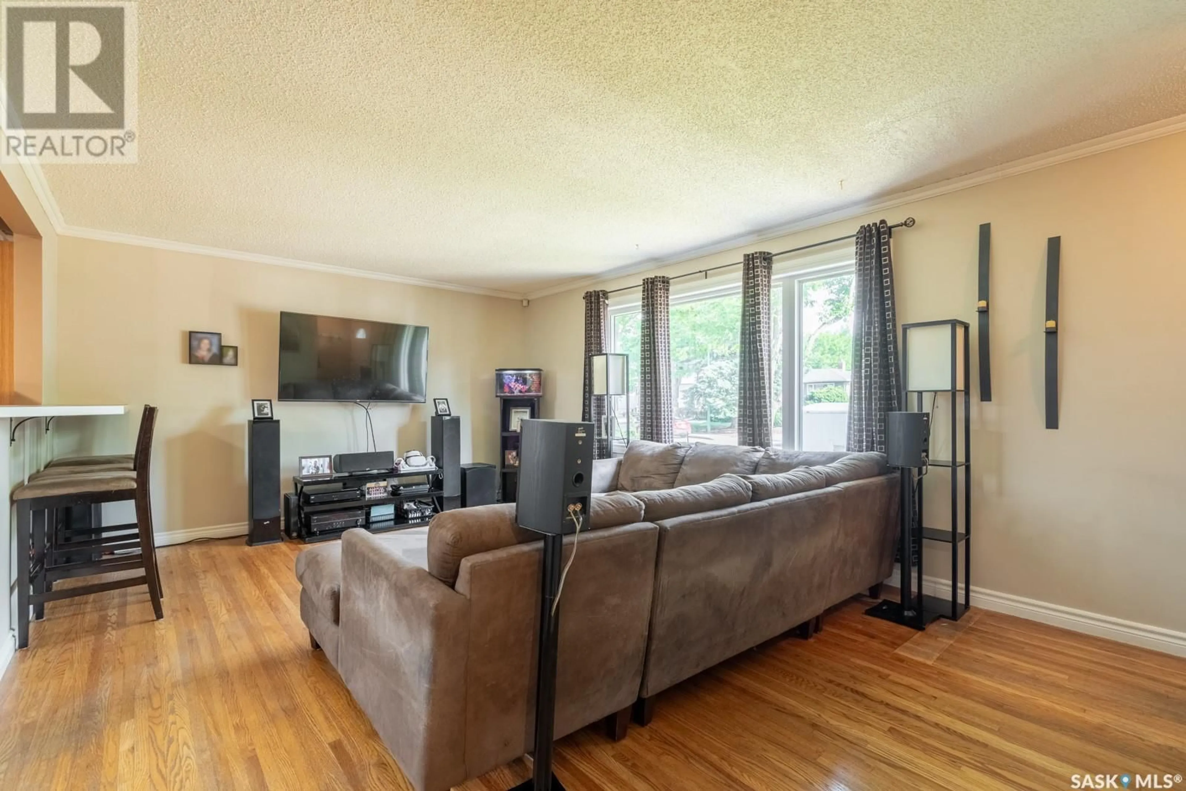 Living room with furniture, wood/laminate floor for 2826 SINTON AVENUE, Regina Saskatchewan S4S1K3