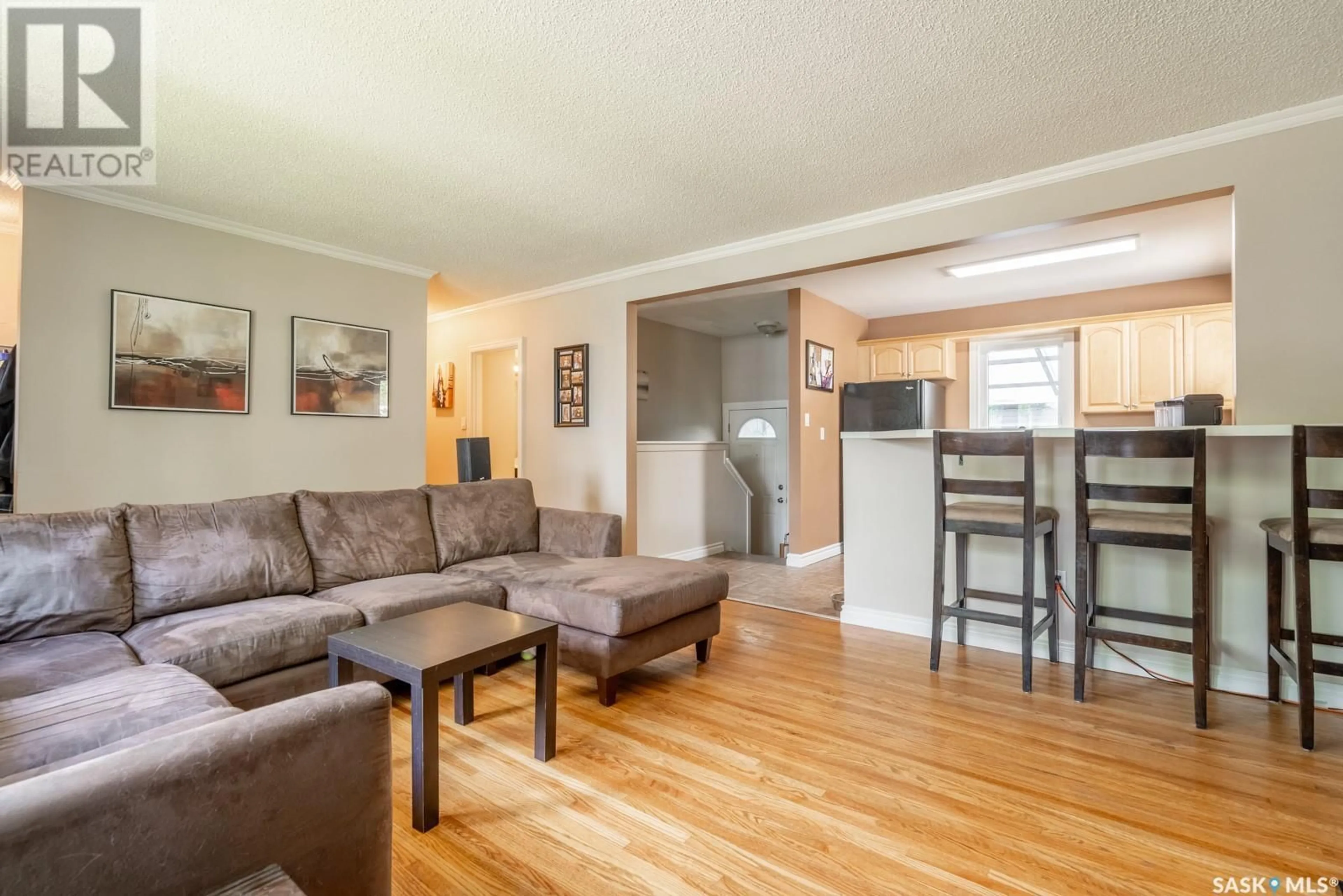 Living room with furniture, wood/laminate floor for 2826 SINTON AVENUE, Regina Saskatchewan S4S1K3