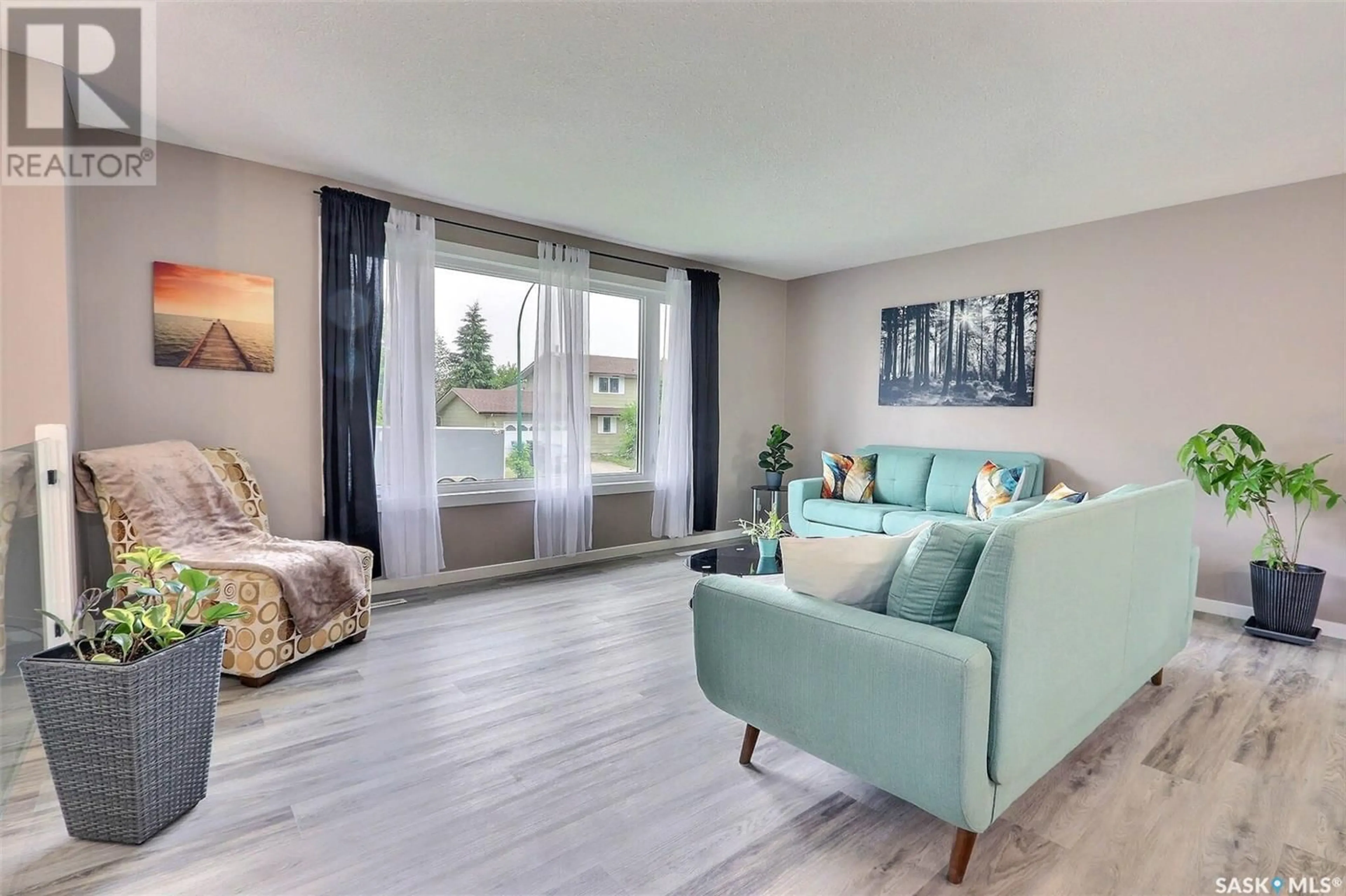 Living room with furniture, wood/laminate floor for 1010 WYLLIE CRESCENT, Prince Albert Saskatchewan S6V6L8