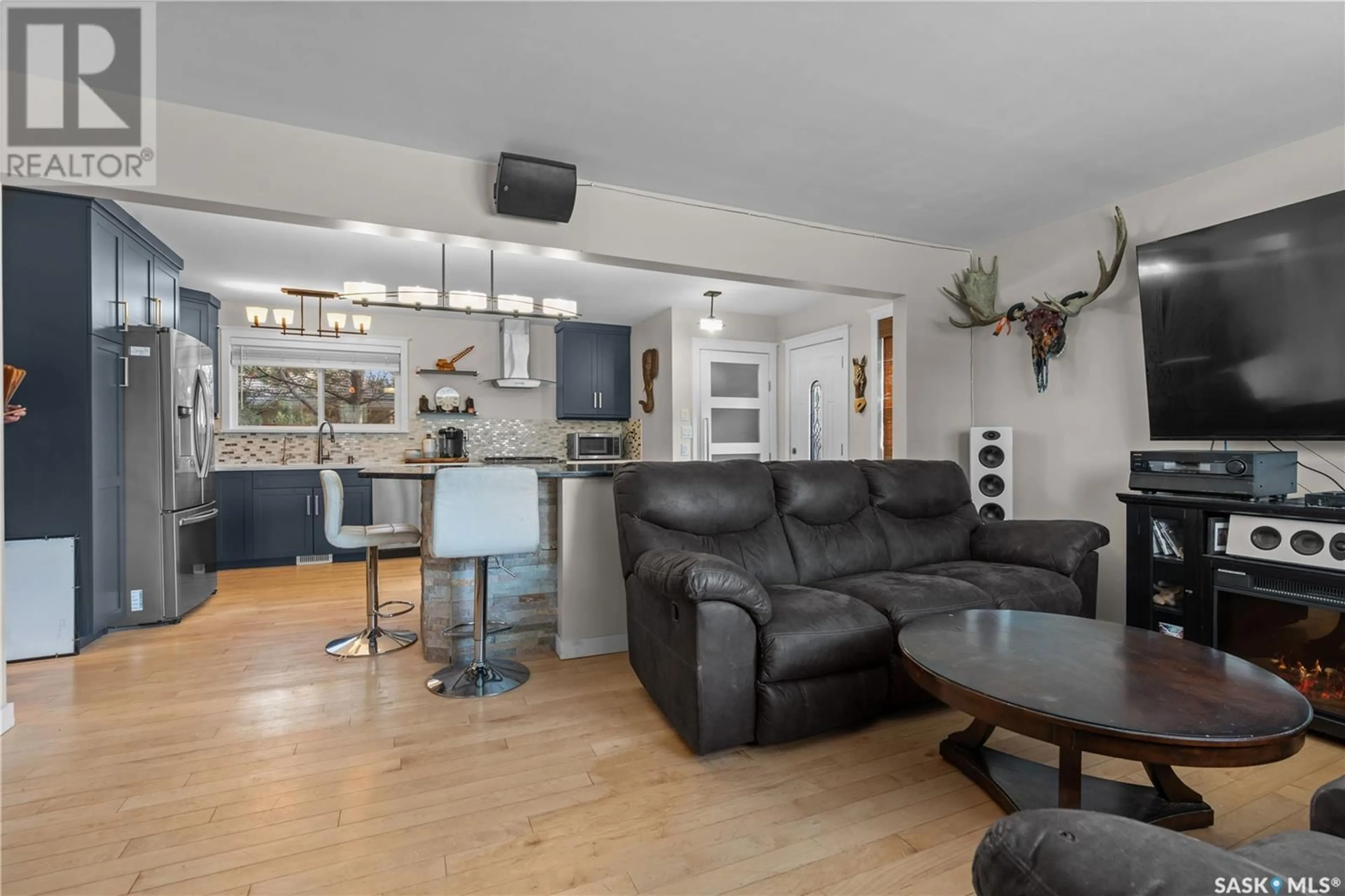 Living room with furniture, wood/laminate floor for 2205 4TH AVENUE, Regina Saskatchewan S4R0T8