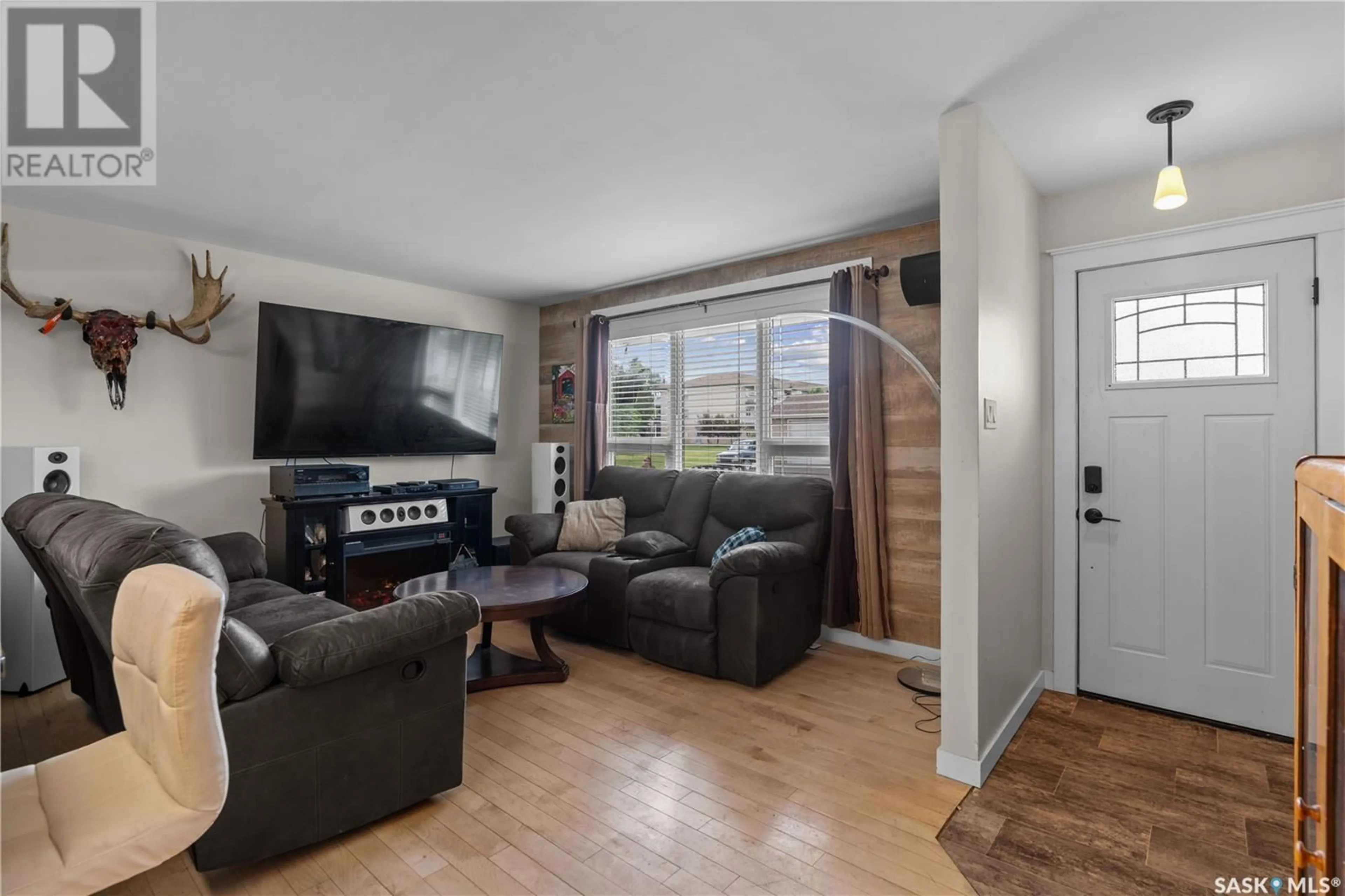 Living room with furniture, wood/laminate floor for 2205 4TH AVENUE, Regina Saskatchewan S4R0T8
