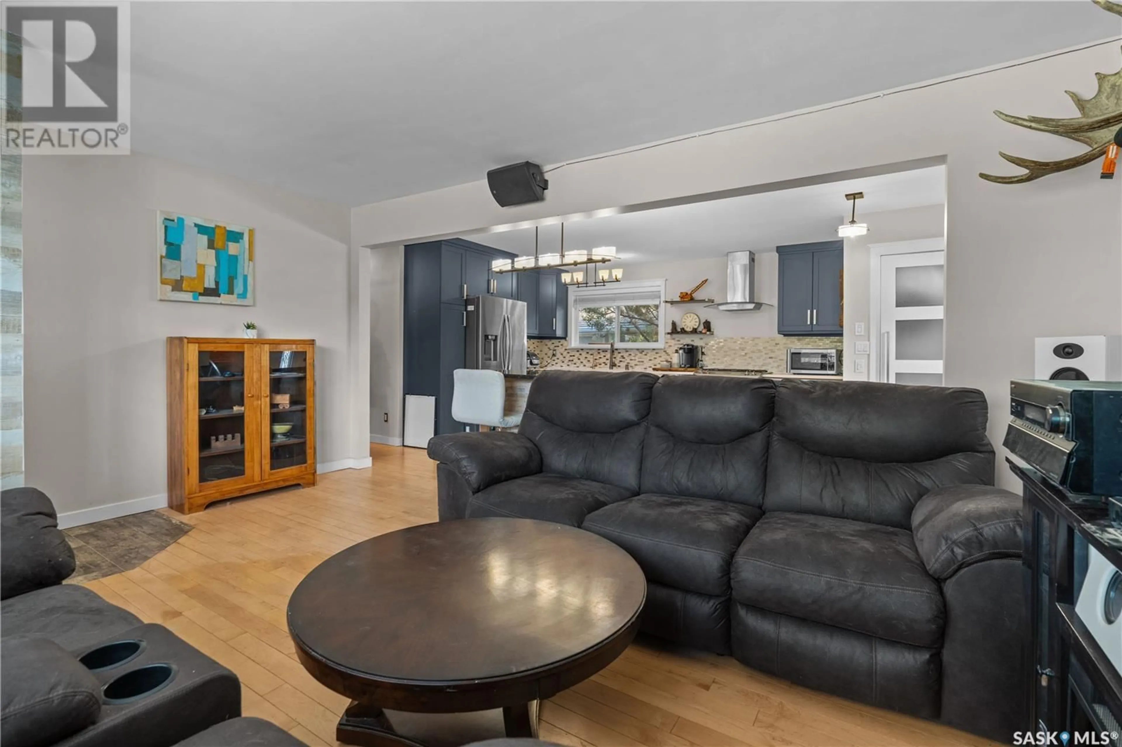 Living room with furniture, wood/laminate floor for 2205 4TH AVENUE, Regina Saskatchewan S4R0T8