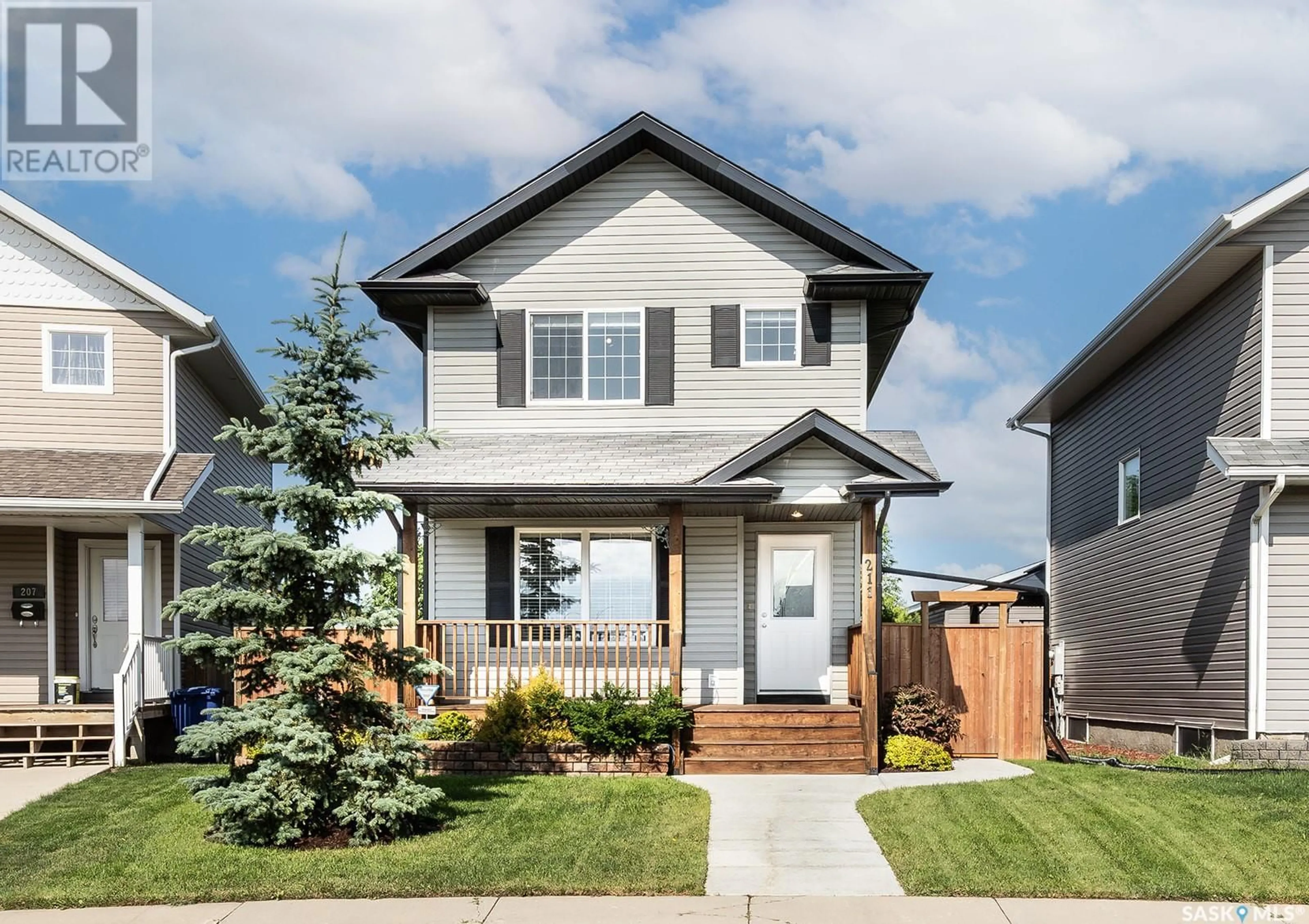 Home with vinyl exterior material, street for 211 BLAKENEY CRESCENT, Saskatoon Saskatchewan S7L7N5