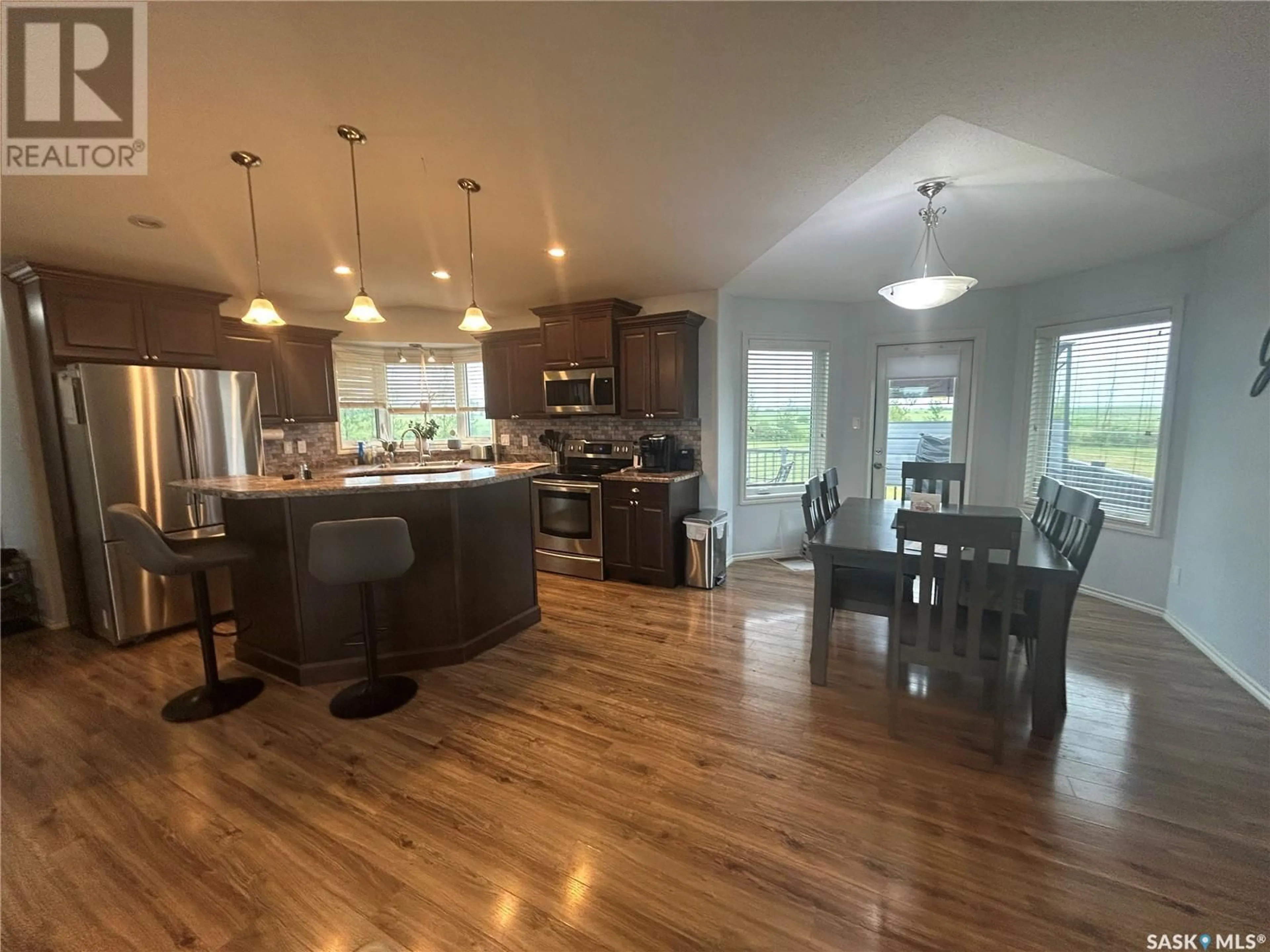 Open concept kitchen, wood/laminate floor for LEWIN ACREAGE, Estevan Rm No. 5 Saskatchewan S4A2A7