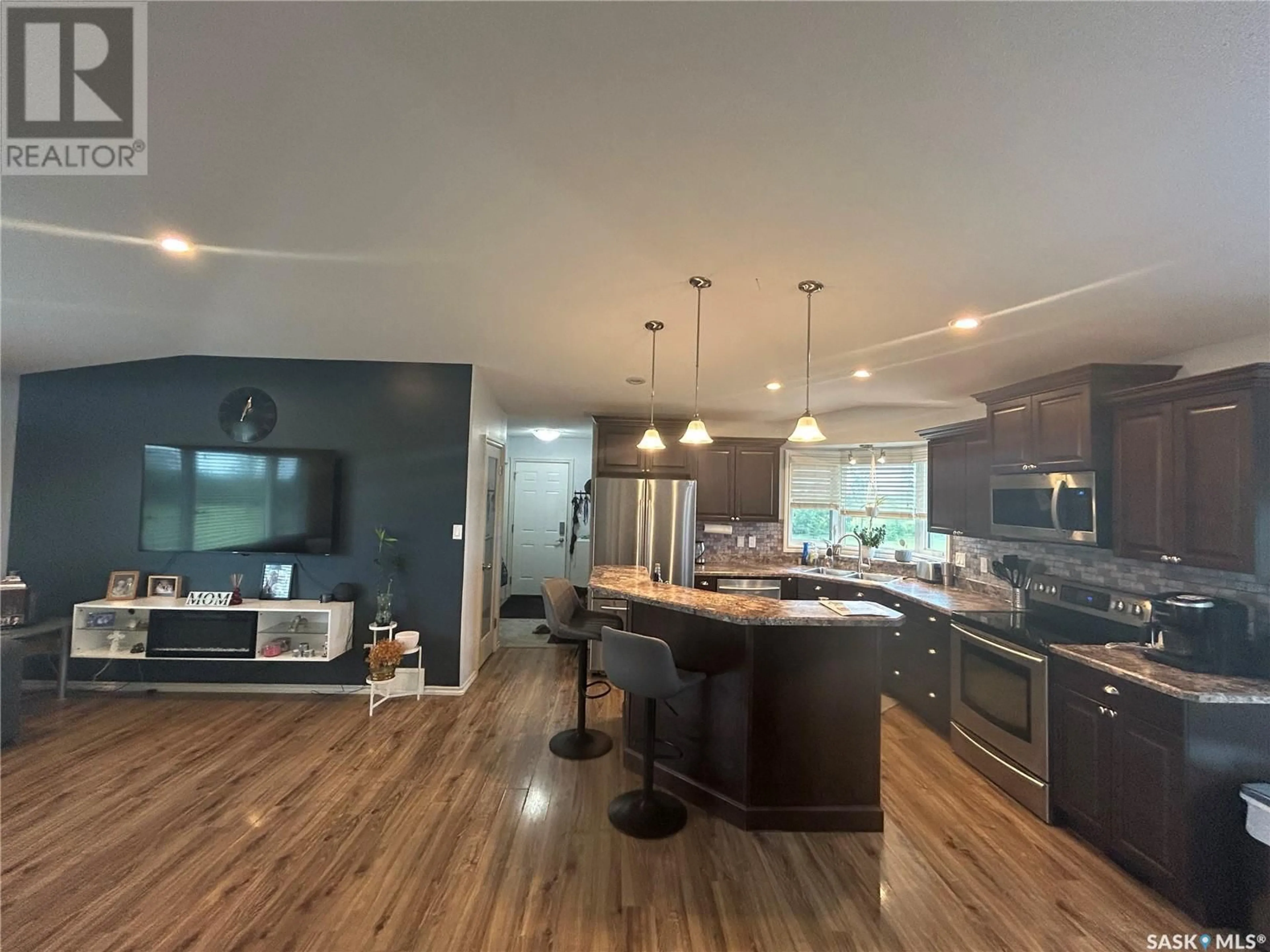 Open concept kitchen, wood/laminate floor for LEWIN ACREAGE, Estevan Rm No. 5 Saskatchewan S4A2A7