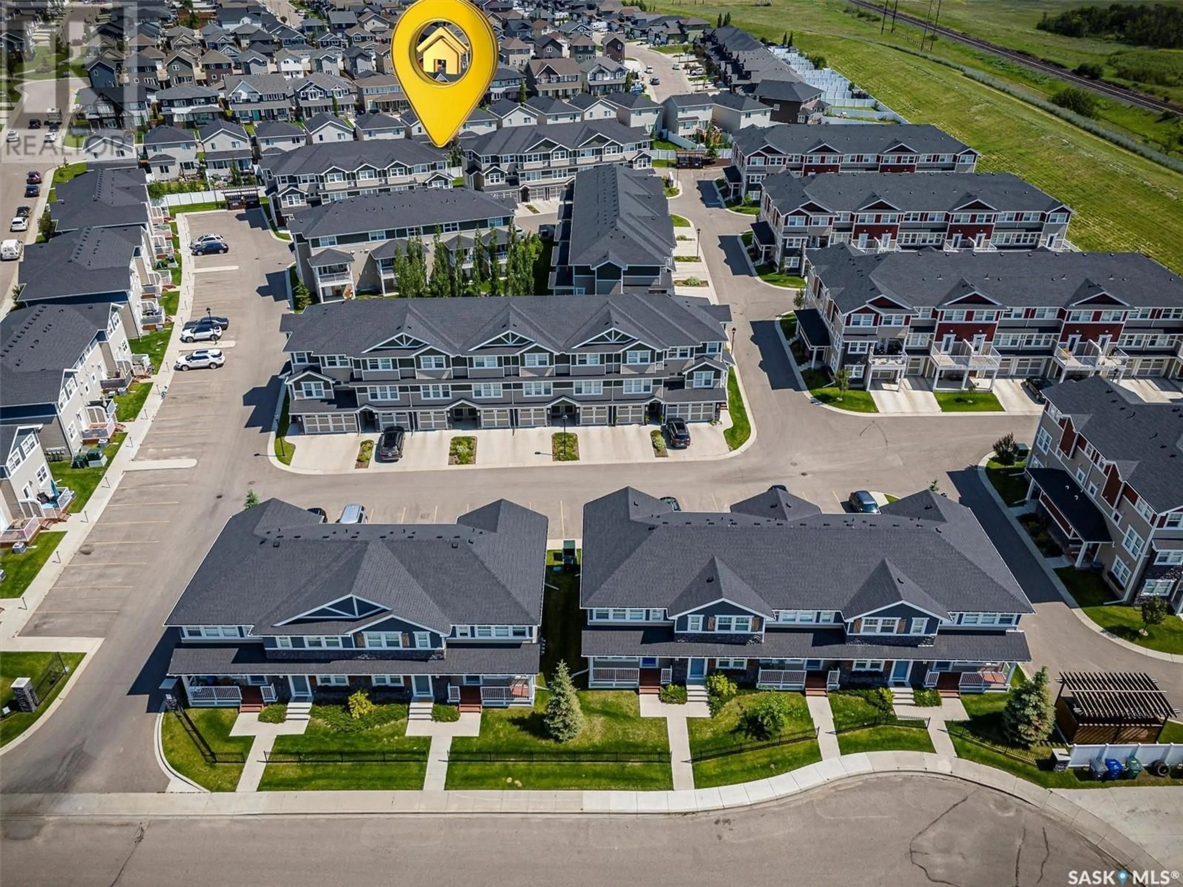 A pic from outside/outdoor area/front of a property/back of a property/a pic from drone, street for 229 1220 PRINGLE WAY, Saskatoon Saskatchewan S7T0X5