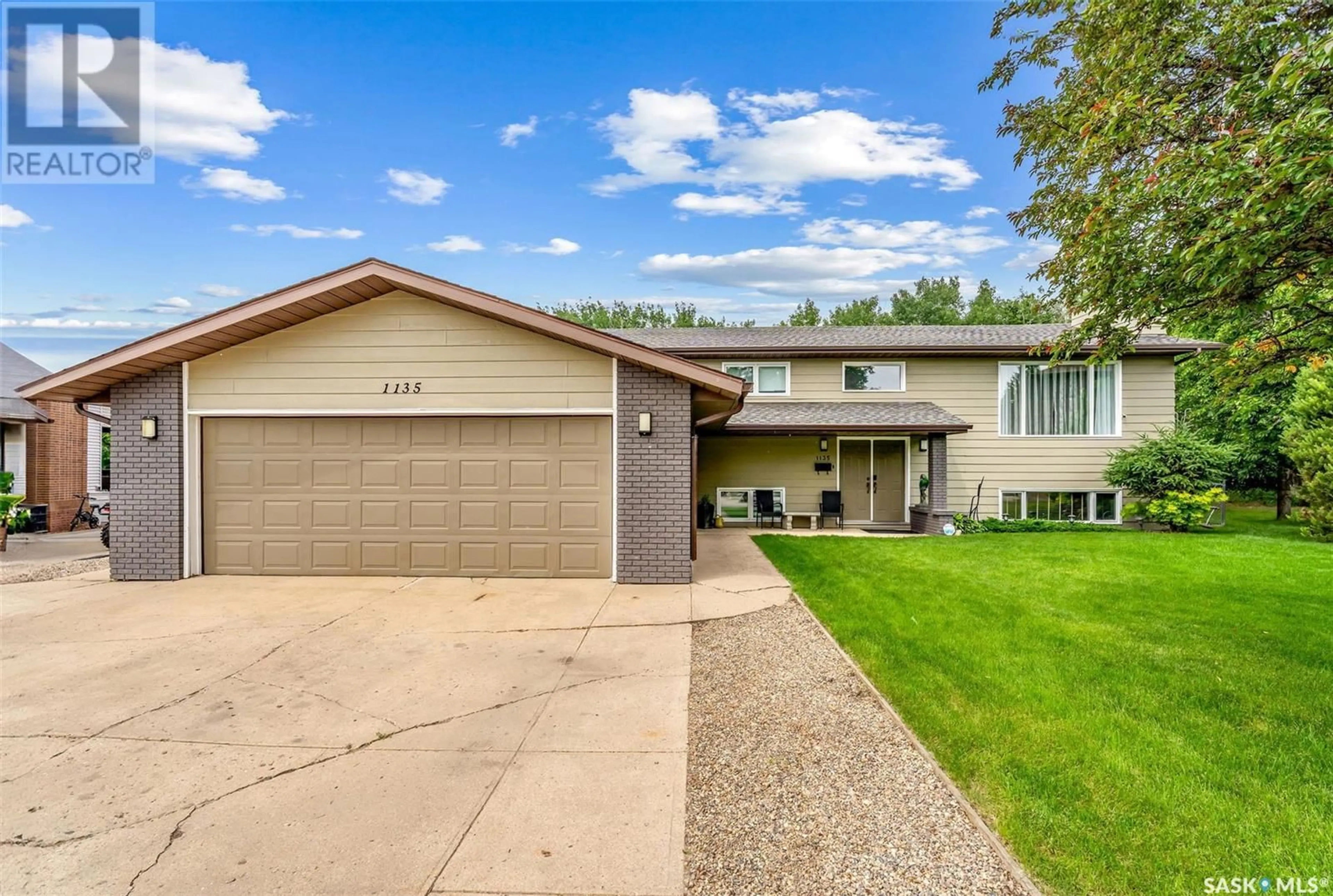 Home with vinyl exterior material, street for 1135 BASARABA PLACE, Prince Albert Saskatchewan S6V7K3